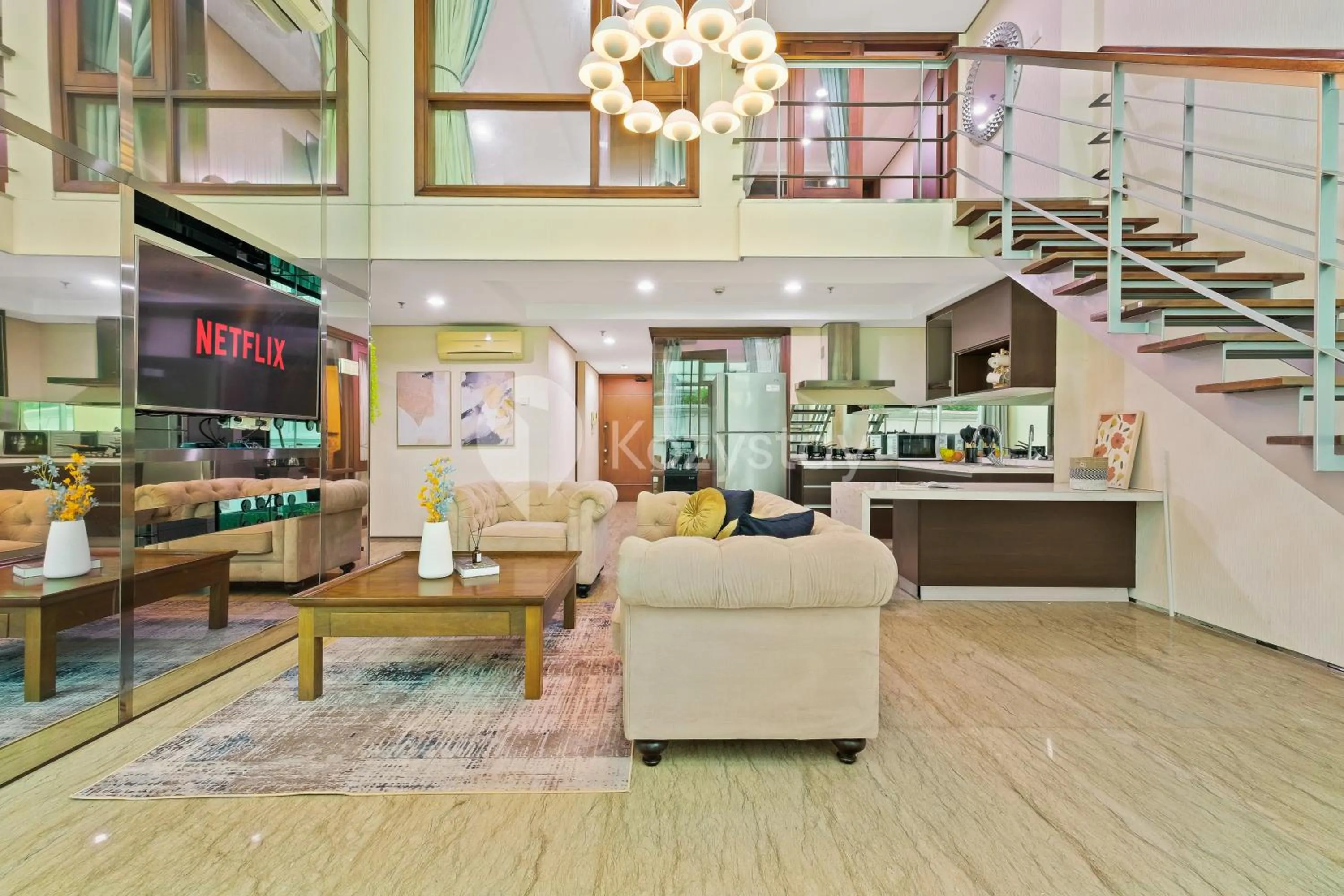 Living room in Callisto by Kozystay - Mega Kuningan