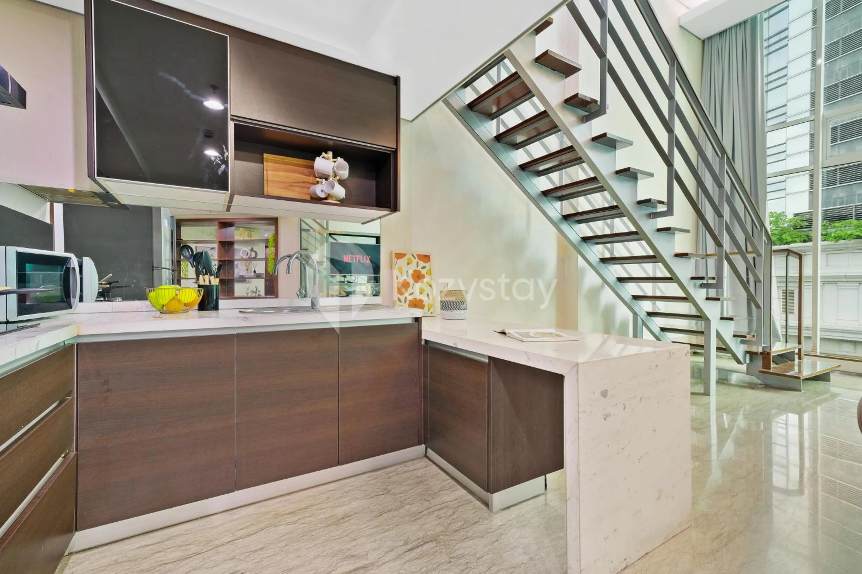 Kitchen or kitchenette in Callisto by Kozystay - Mega Kuningan
