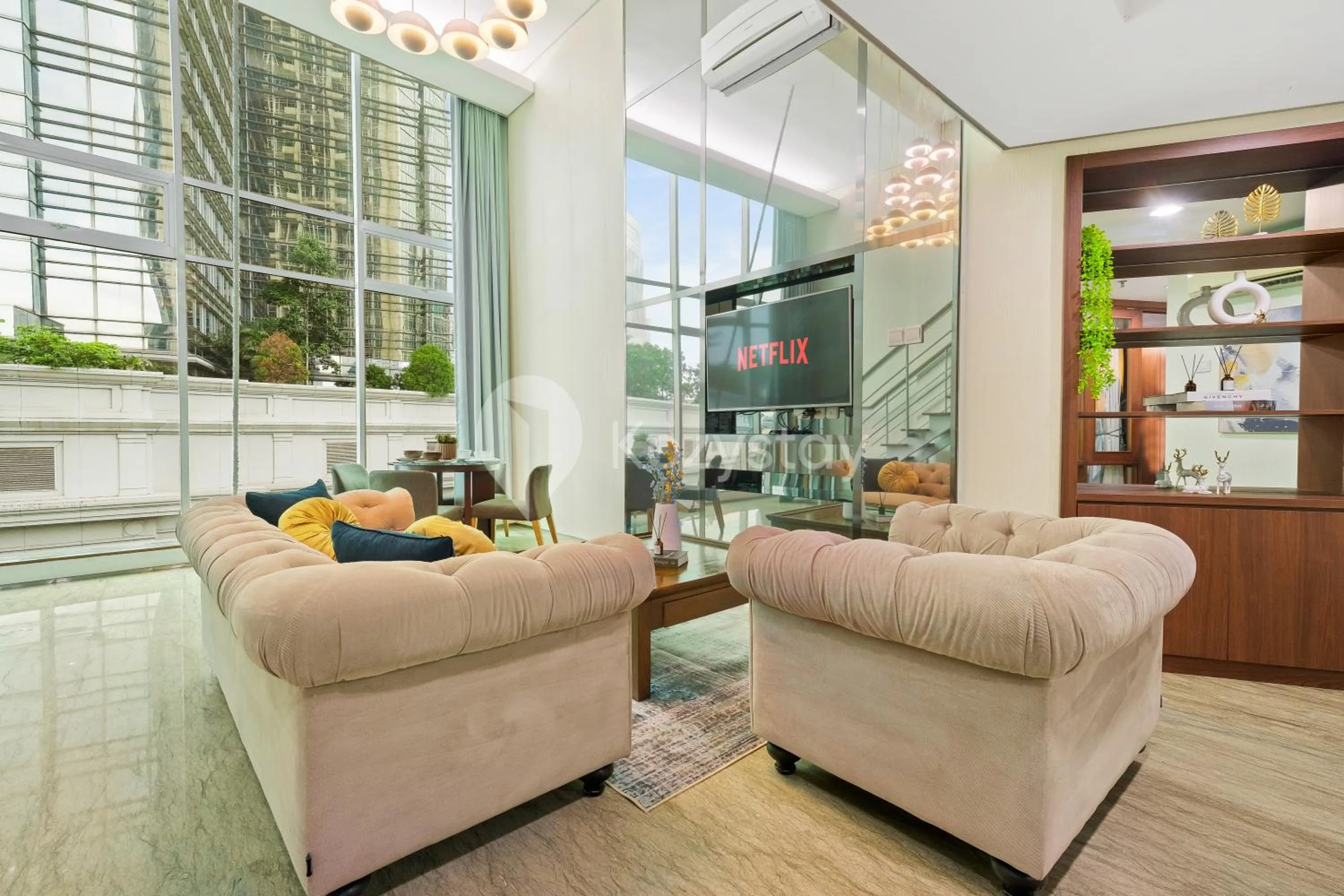 Living room in Callisto by Kozystay - Mega Kuningan