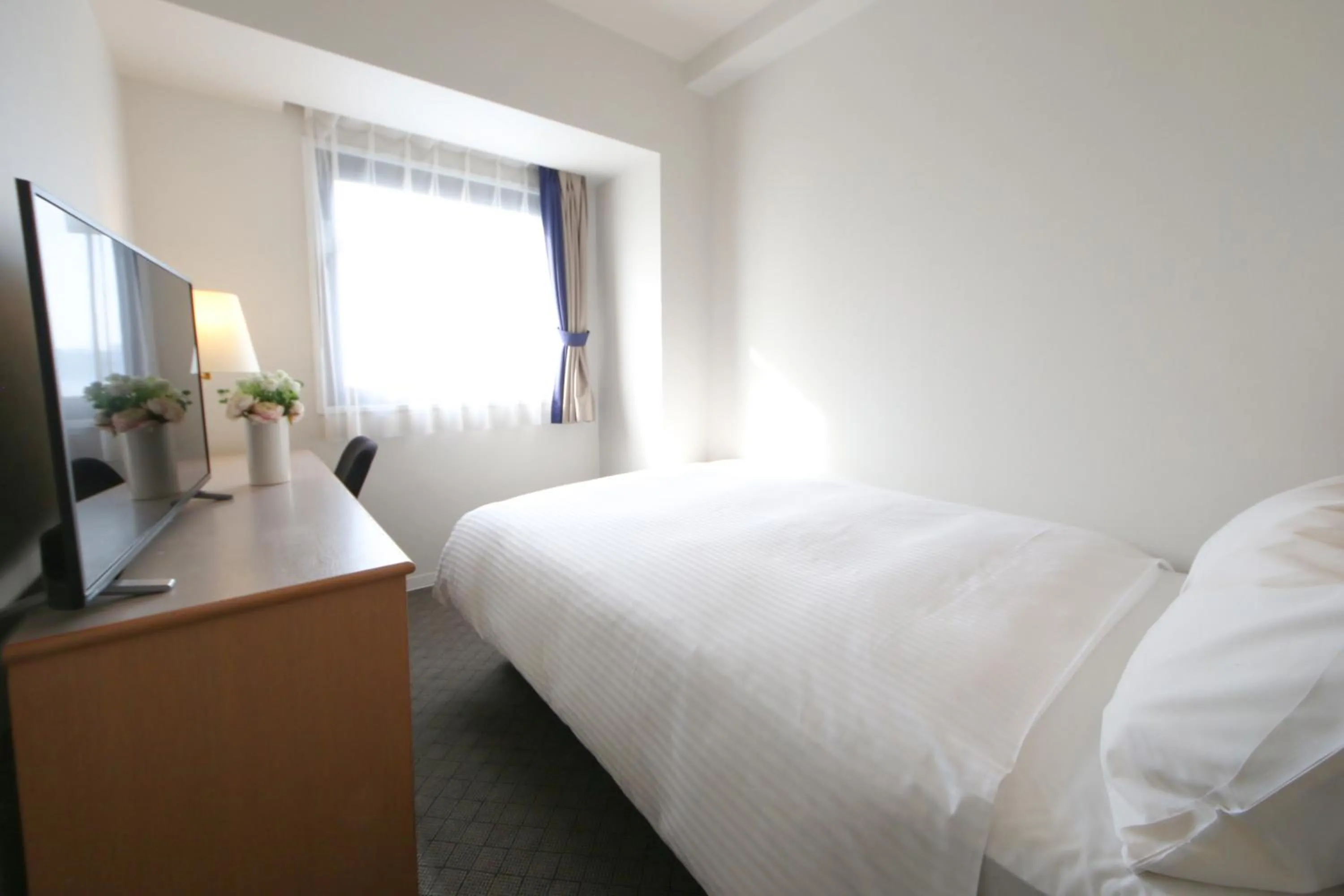 Bed in Grand Park Hotel Panex Kimitsu