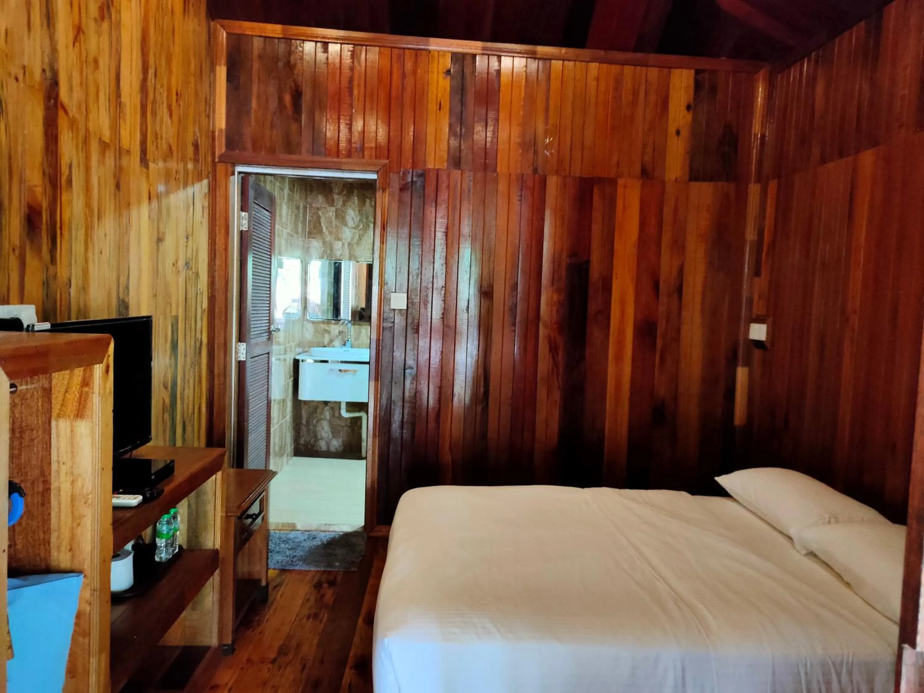 Photo of the whole room, TV/Entertainment Center in KEMBARA RESORT