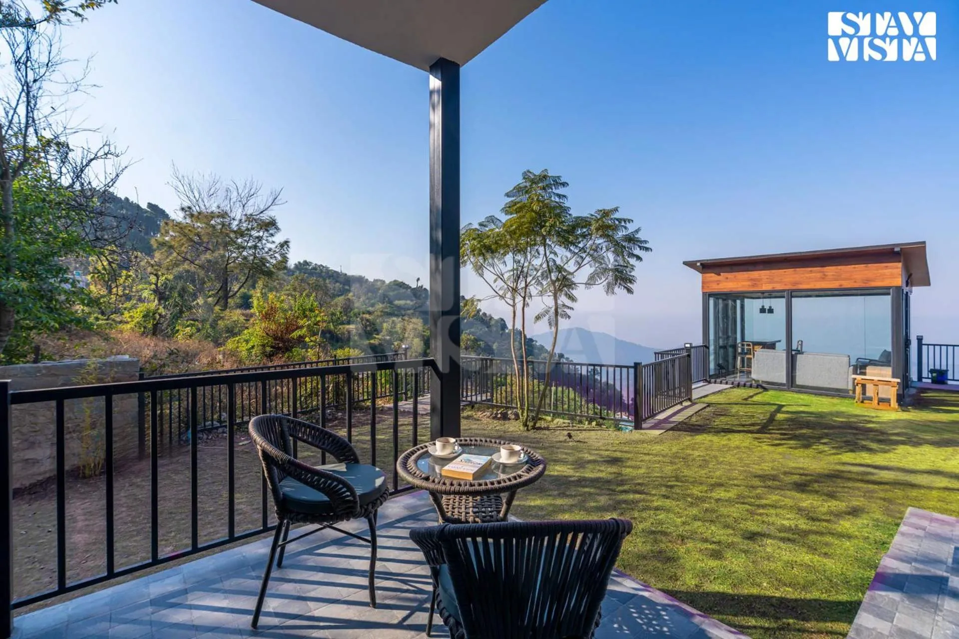 Seating area in StayVista at Savara with Heated Infinity Pool and Jacuzzi