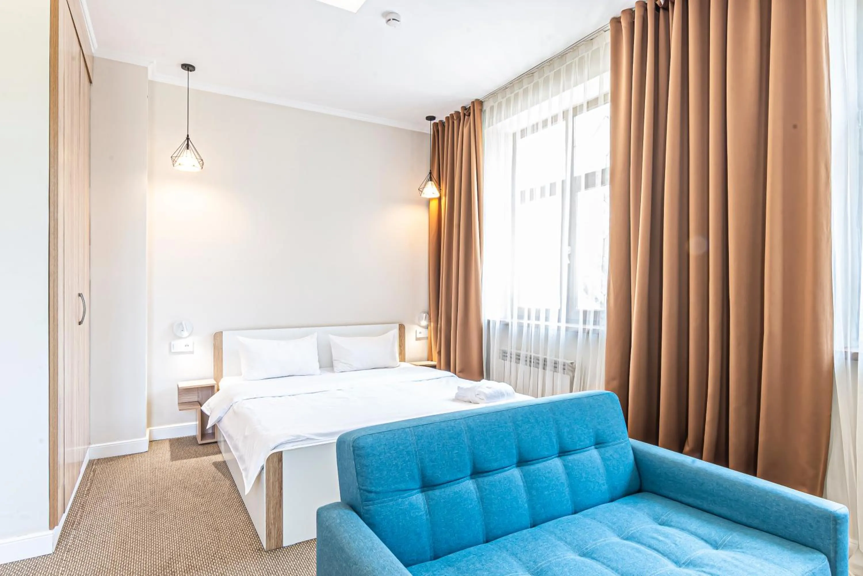 Seating area, Bed in AYKUN Hotel
