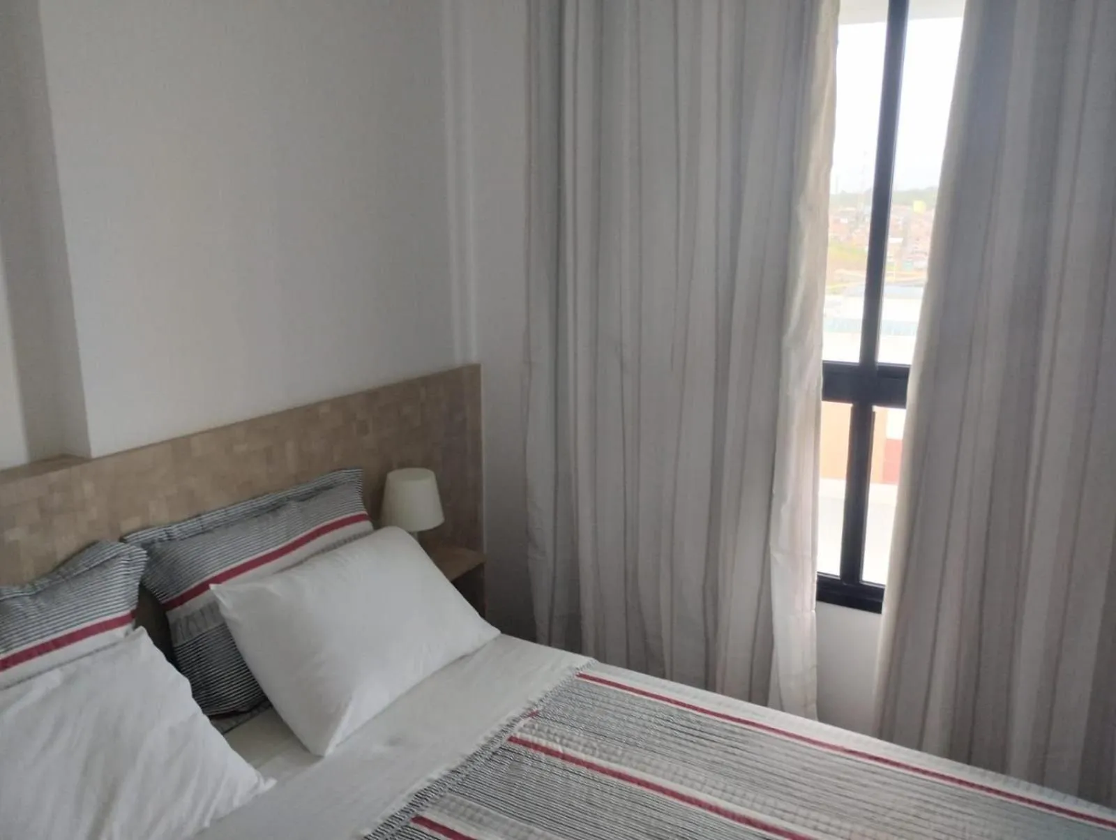 Bed in Mondial Apartments By BnbHost