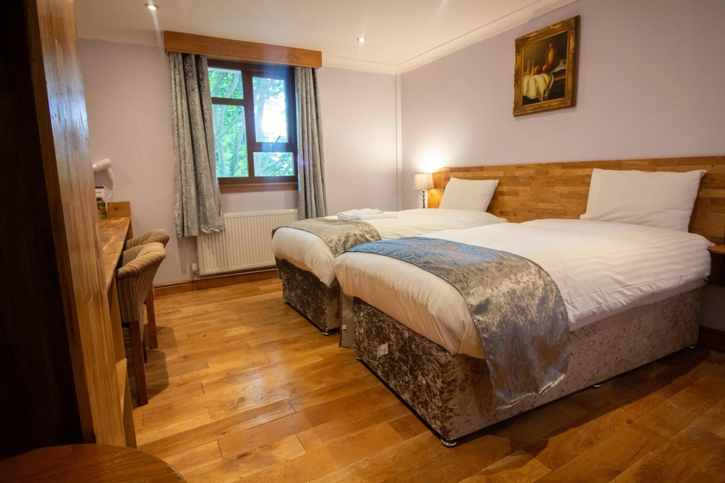 Bed in Westone Manor Hotel