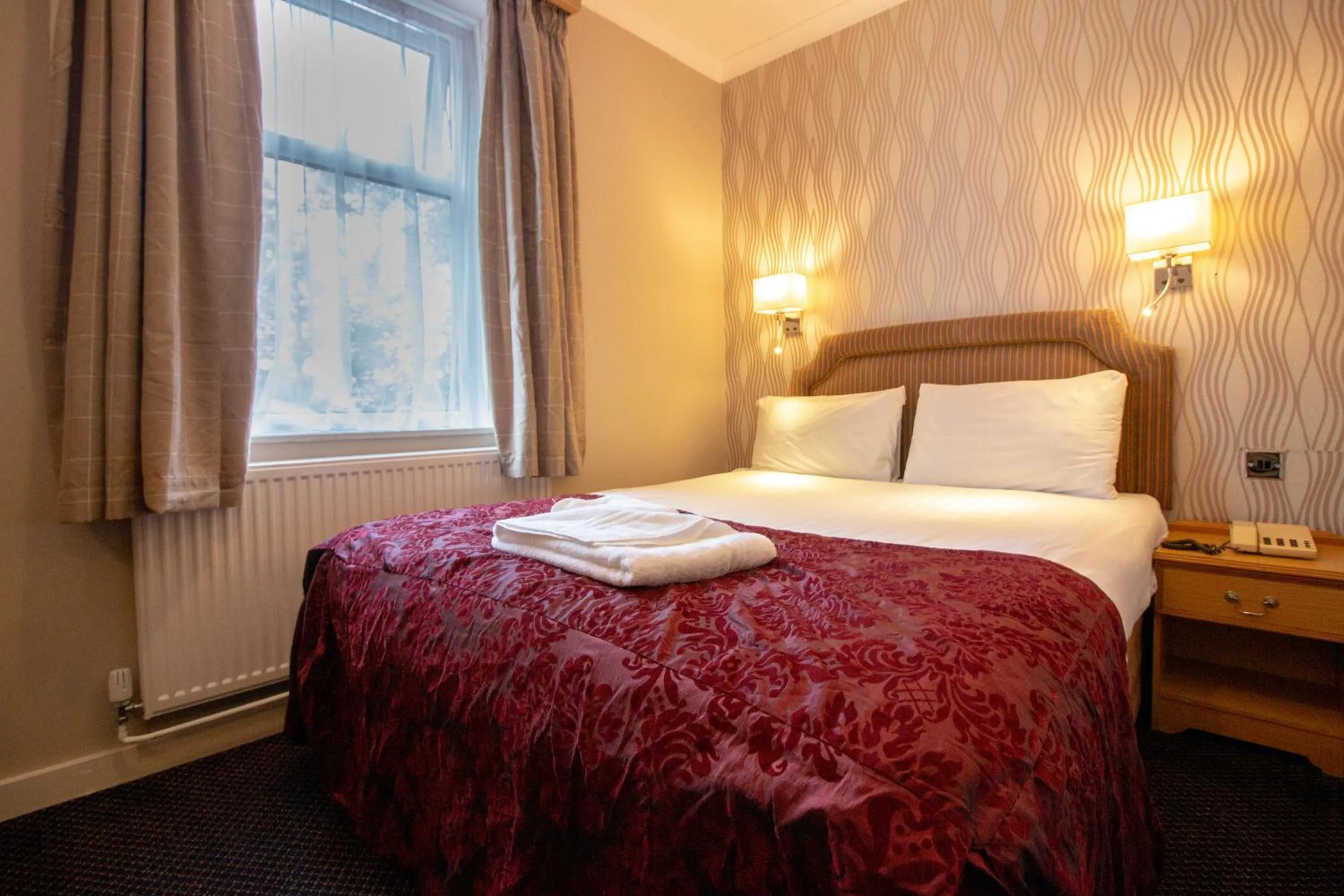 Bed in Westone Manor Hotel