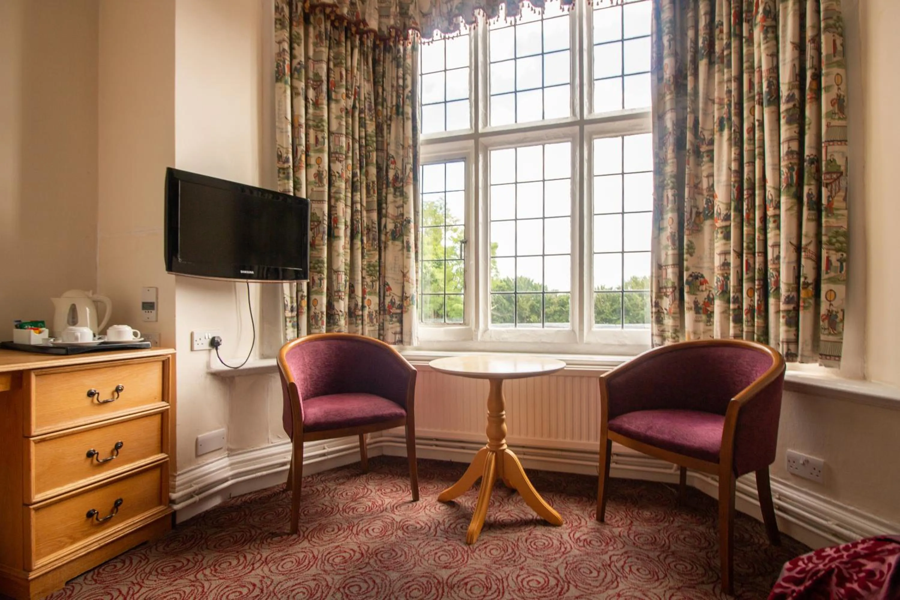 Bedroom in Westone Manor Hotel