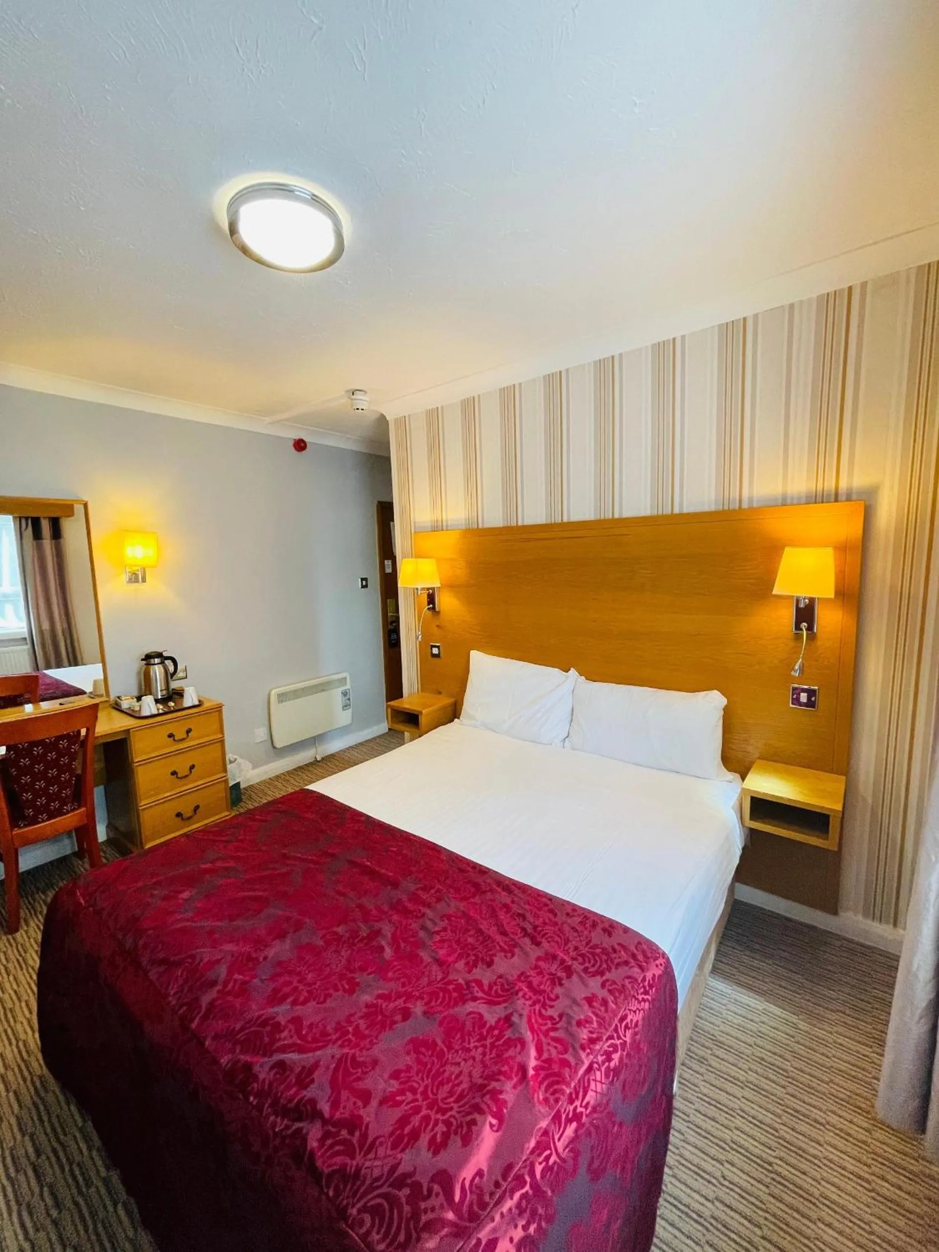 Bed in Westone Manor Hotel