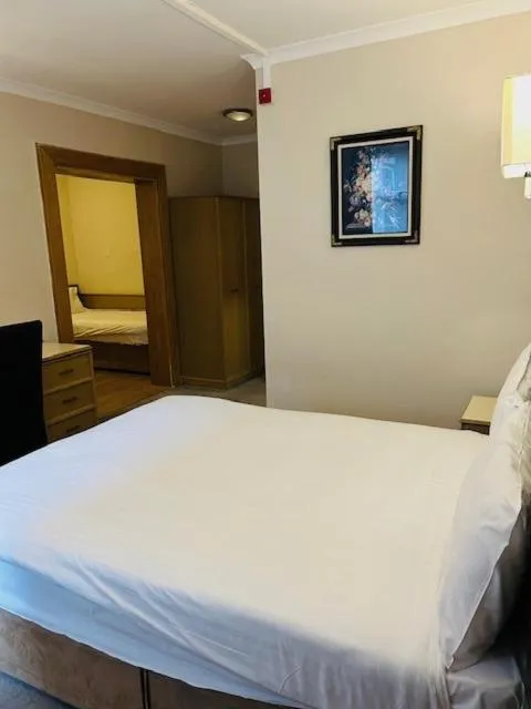 Bed in Westone Manor Hotel