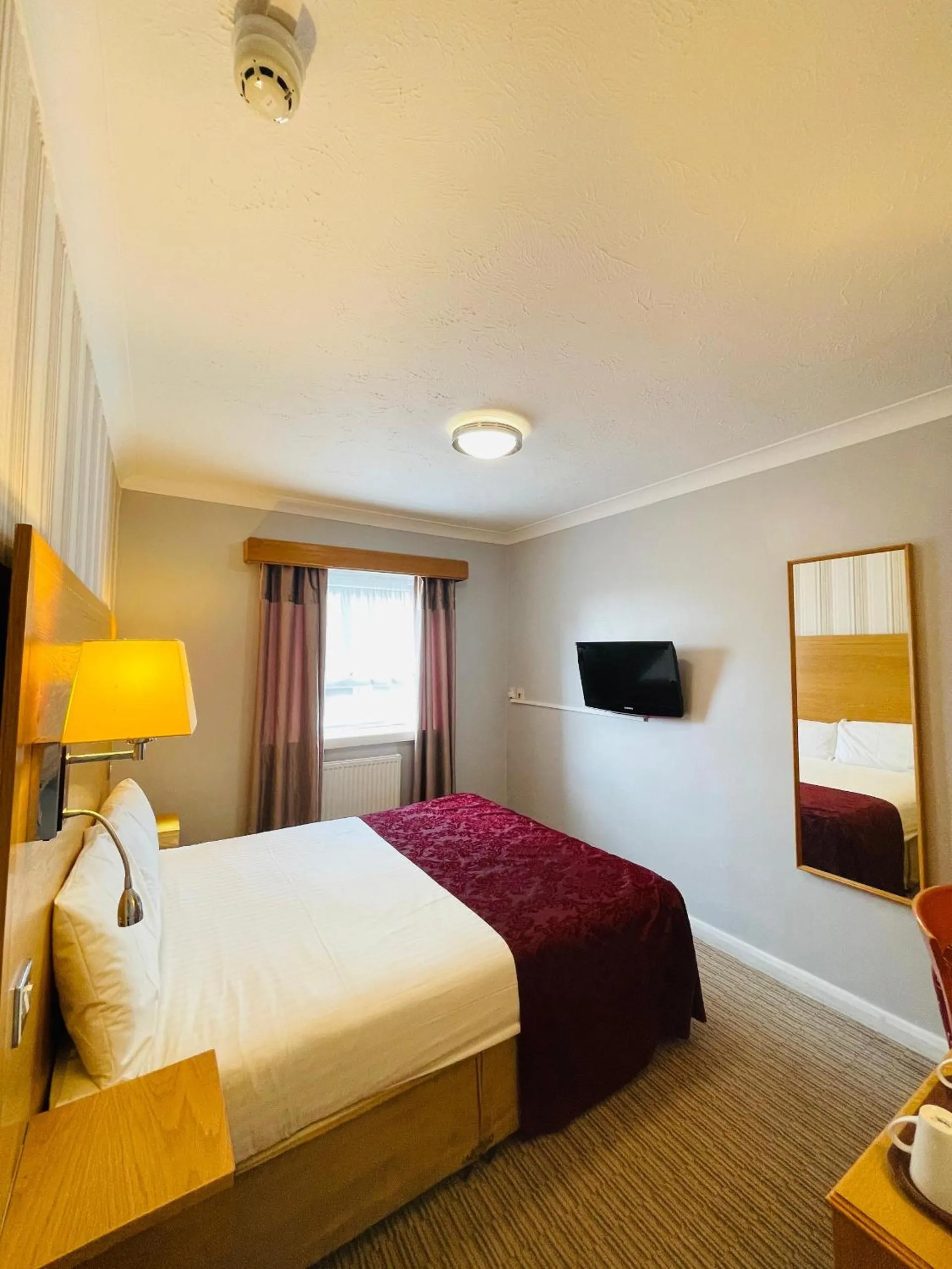 Bed in Westone Manor Hotel