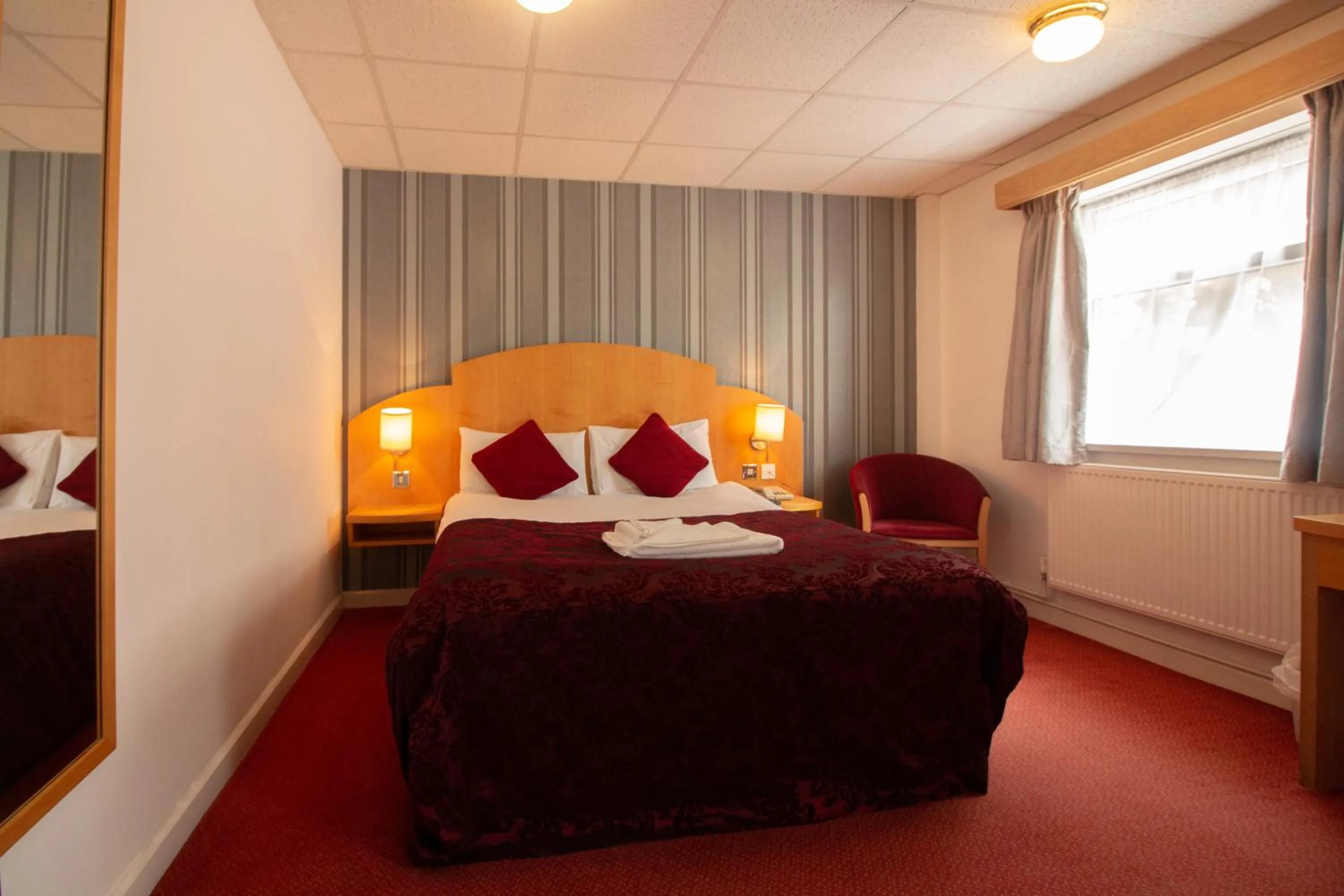 Bed in Westone Manor Hotel