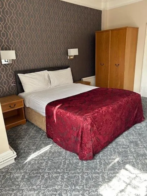 Bed in Westone Manor Hotel