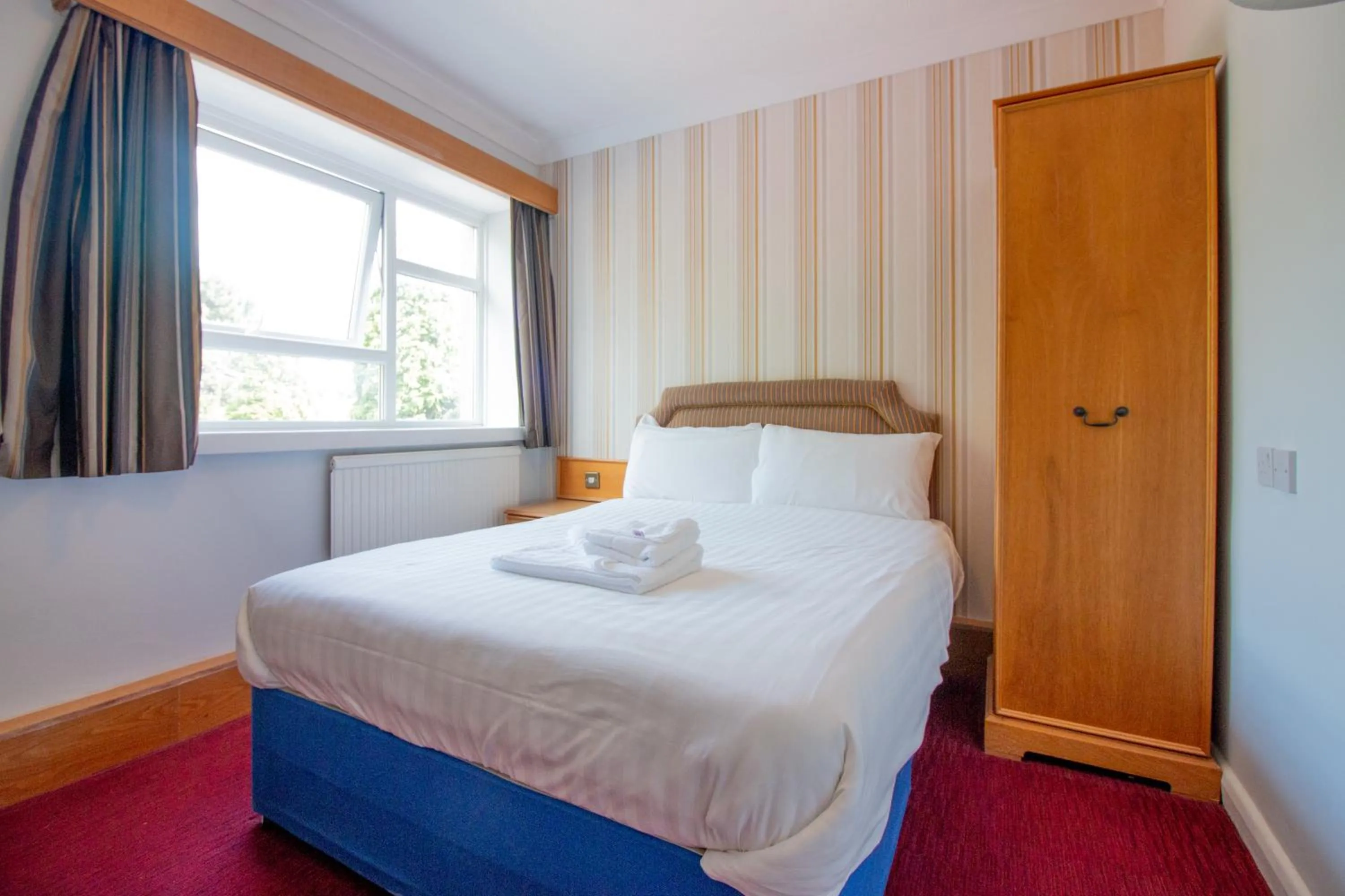 Bed in Westone Manor Hotel