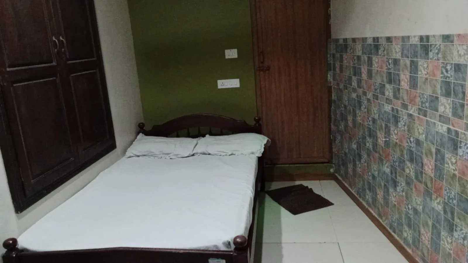 Bed in JAYA BHARATHI LODGE