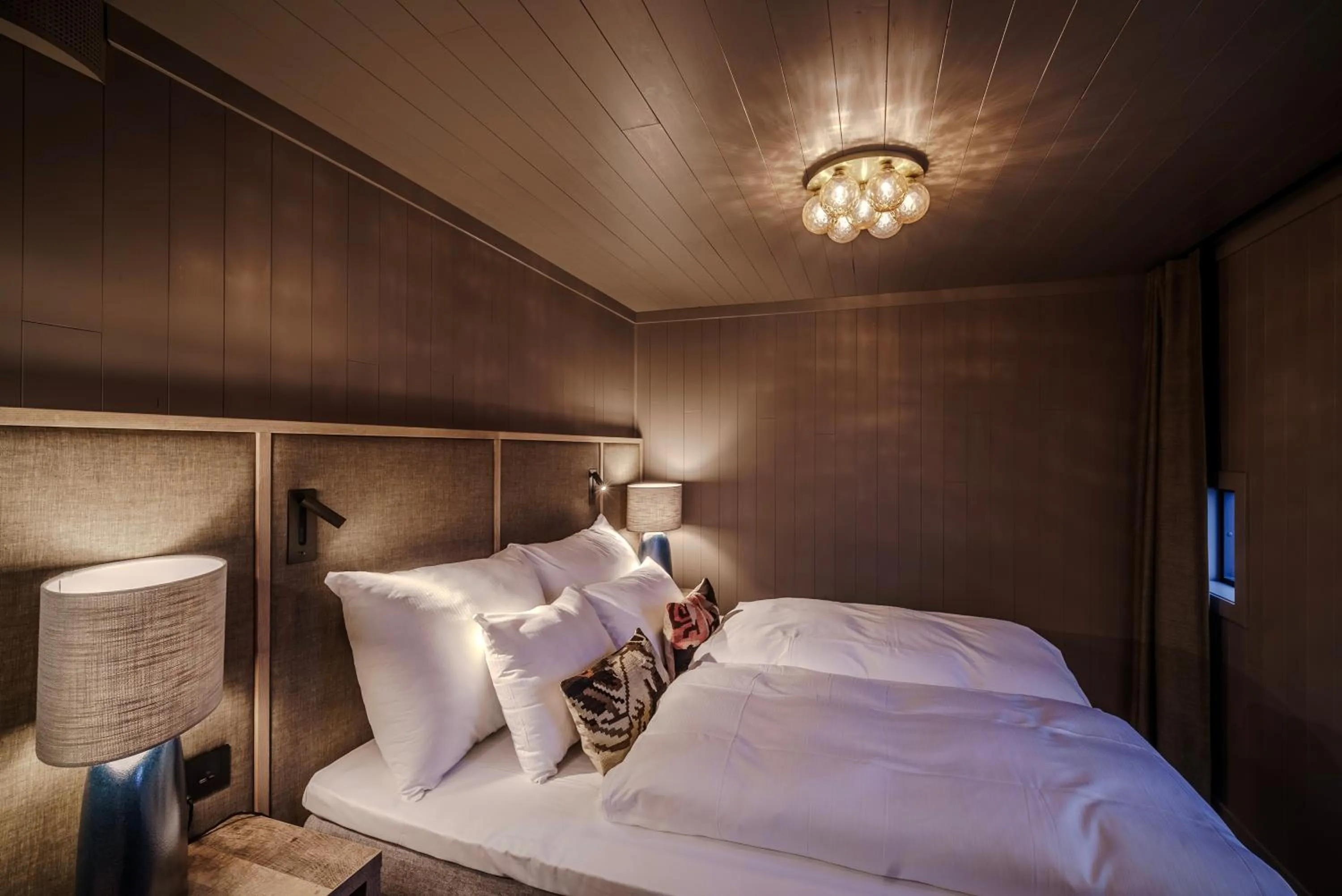 Bed in Henningsvær Bryggehotell - by Classic Norway Hotels