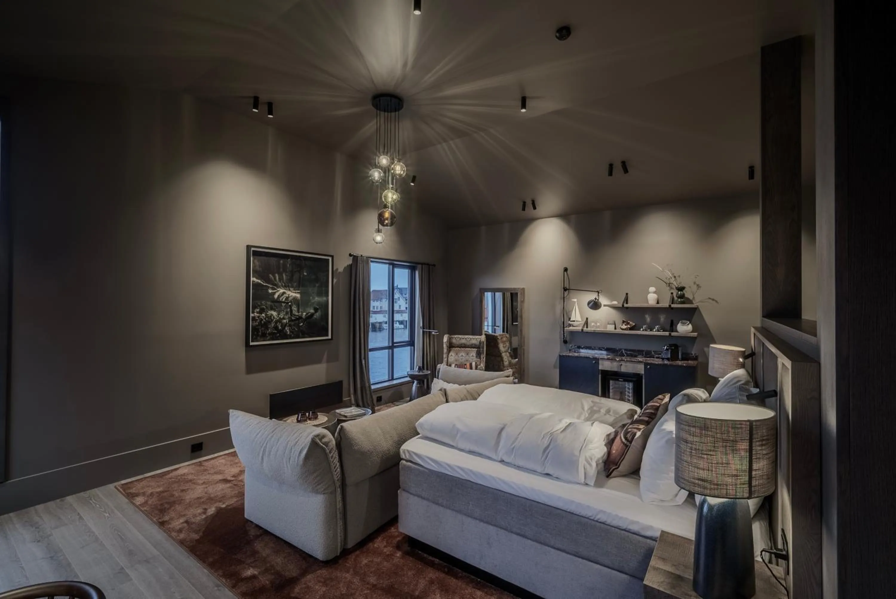 Living room, Bed in Henningsvær Bryggehotell - by Classic Norway Hotels
