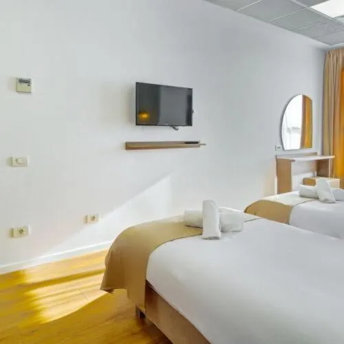 Bed in Sir Fundeni Hotel