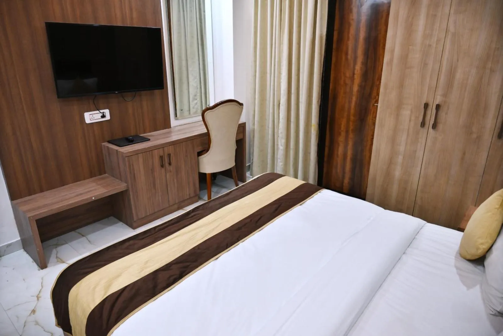 Bed in Hotel Navraj Palace