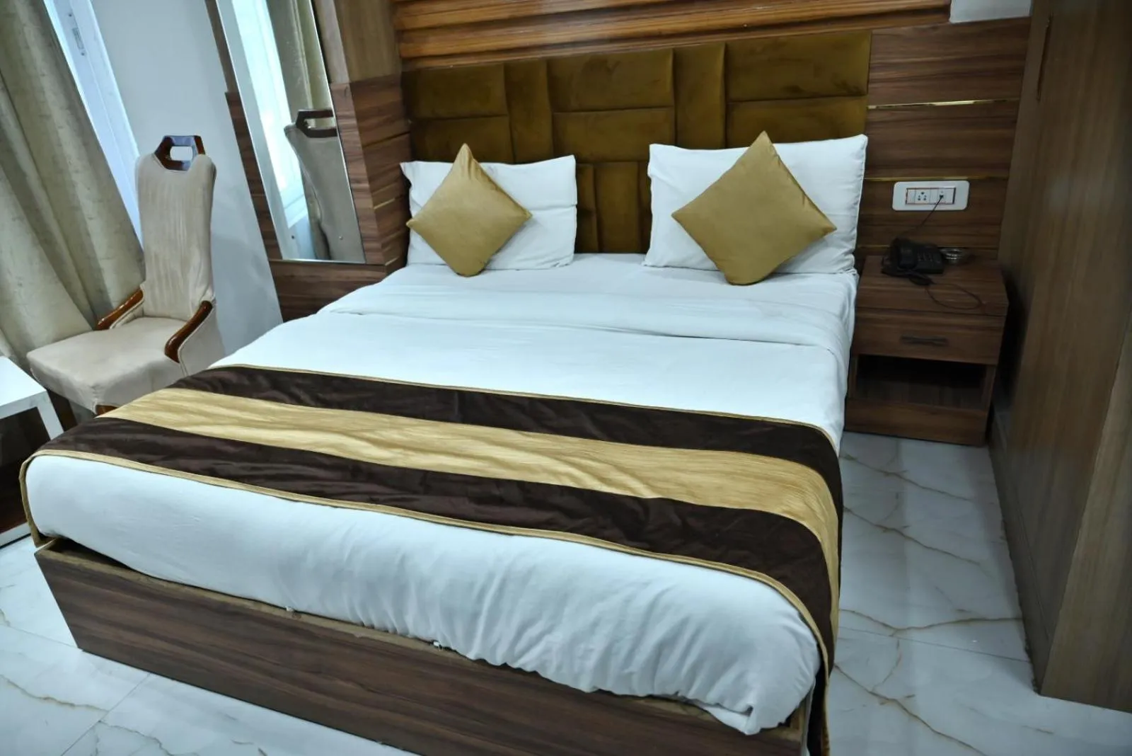 Bed in Hotel Navraj Palace