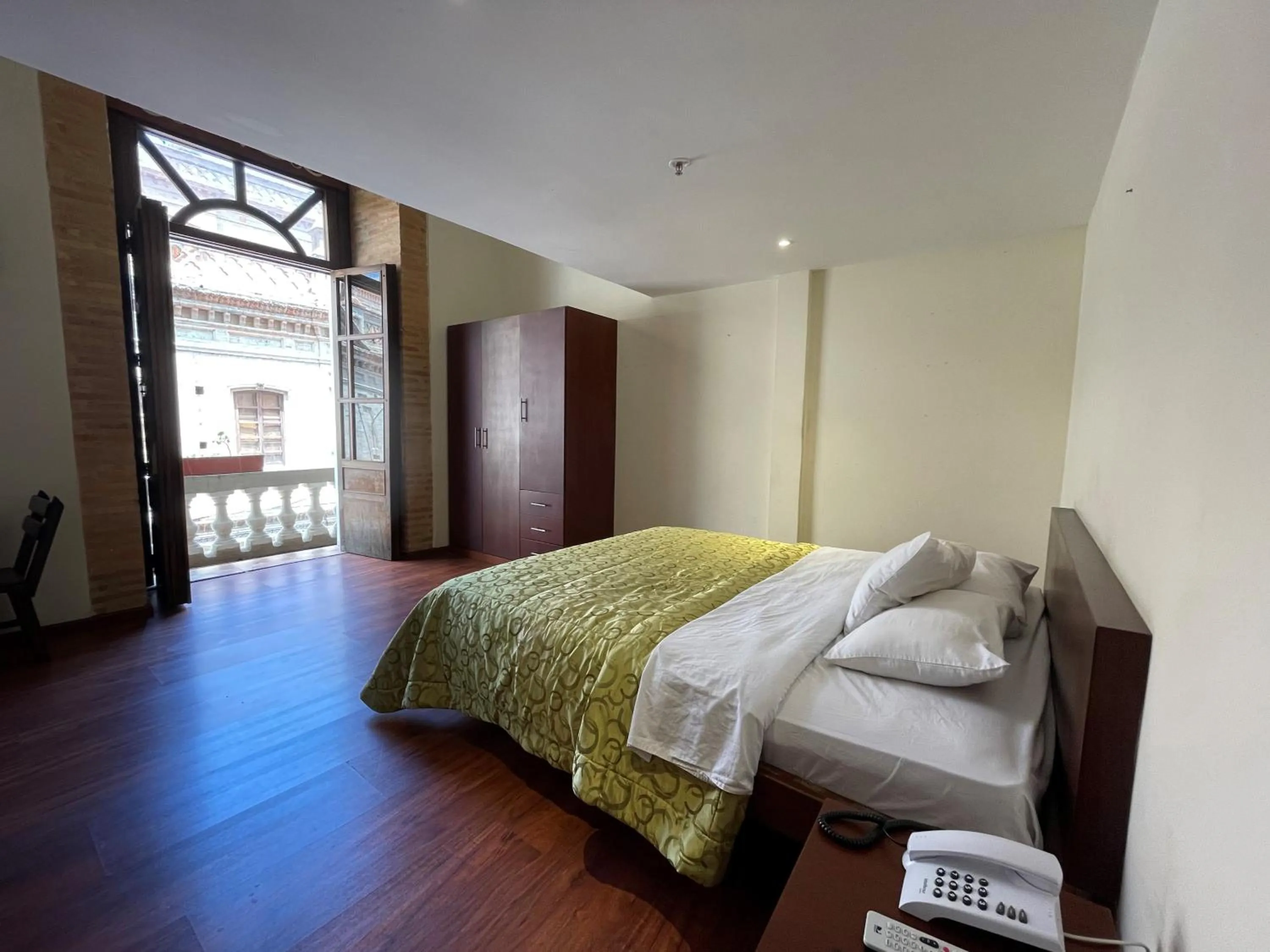 Photo of the whole room, Bed in Floré Hotel Boutique Cuenca