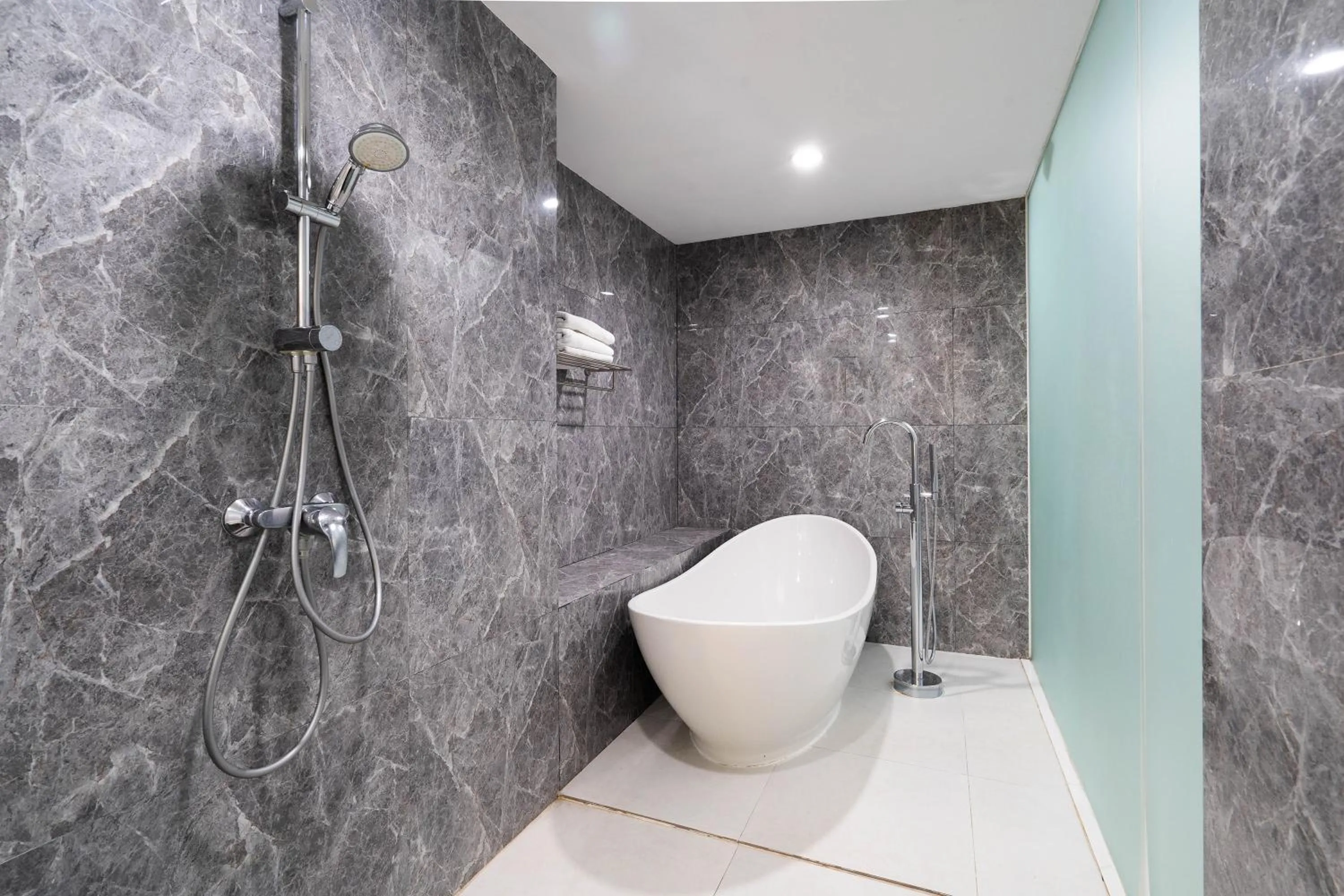 Shower in Cozy Stay Bali by ARM Hospitality