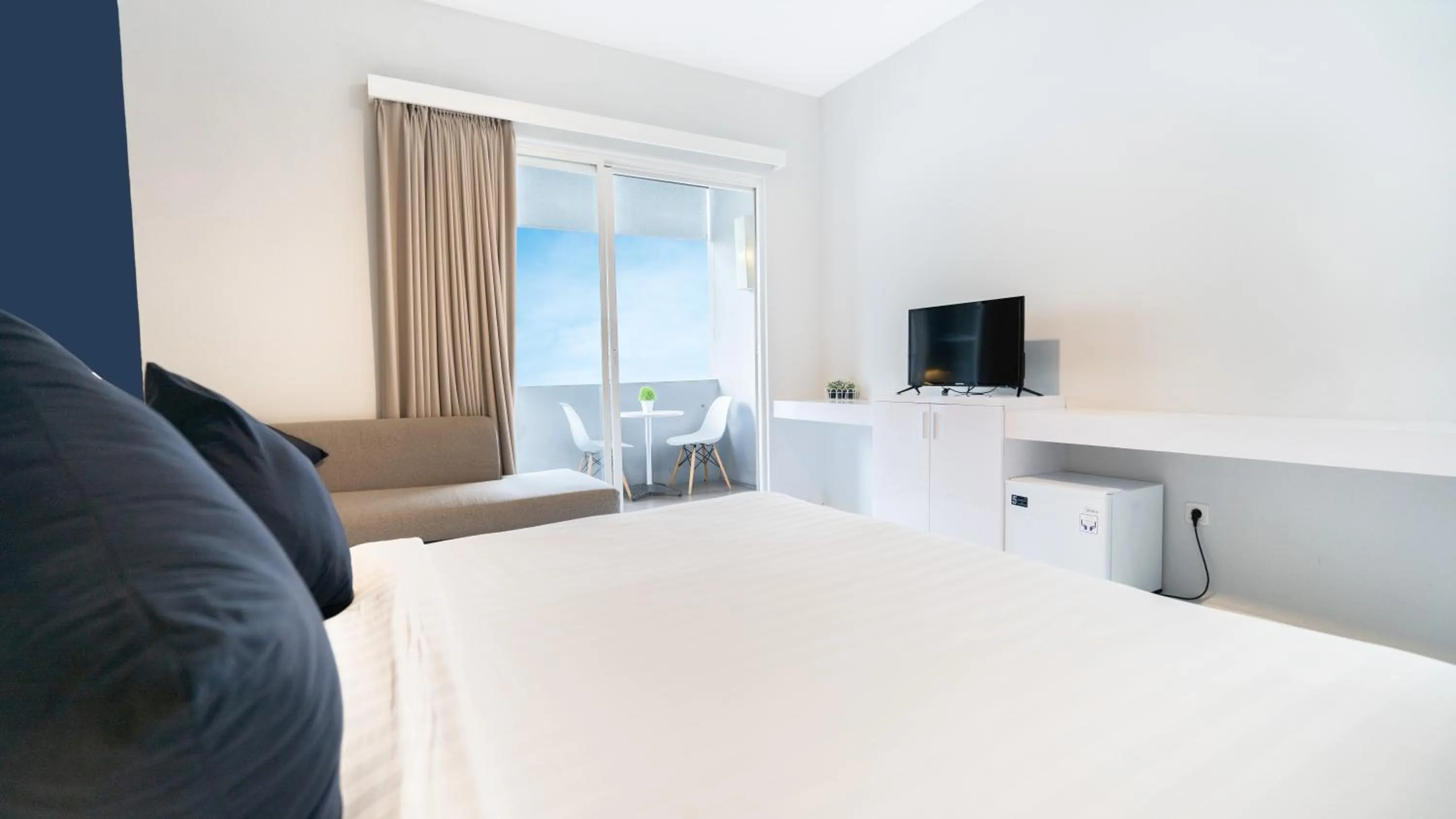 Bed in Cozy Stay Bali by ARM Hospitality