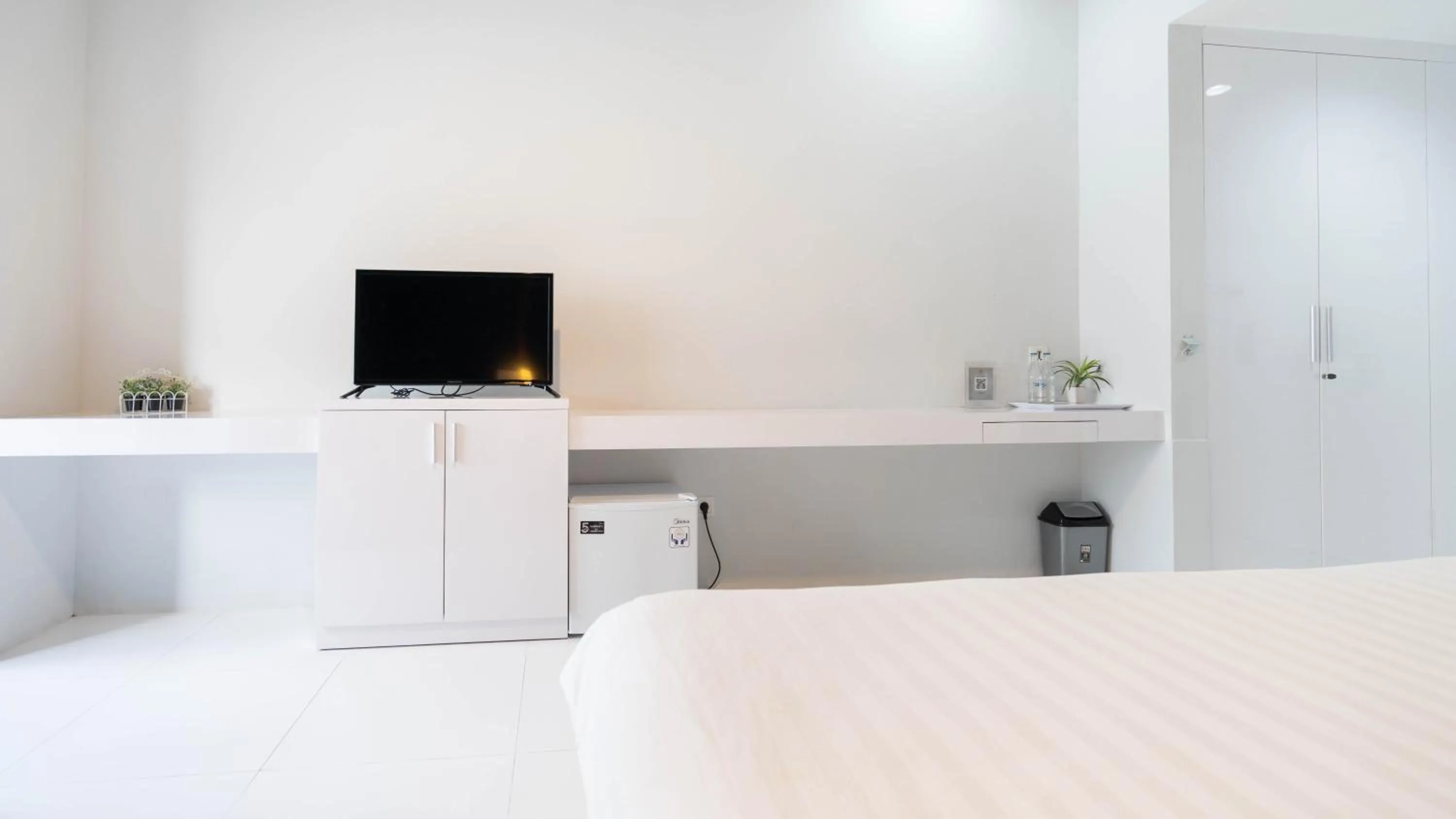 Bed in Cozy Stay Bali by ARM Hospitality