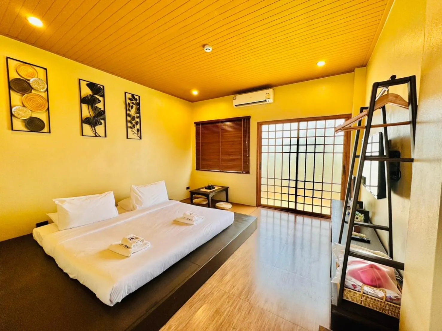 Bed in COZY SHIROI RESORT