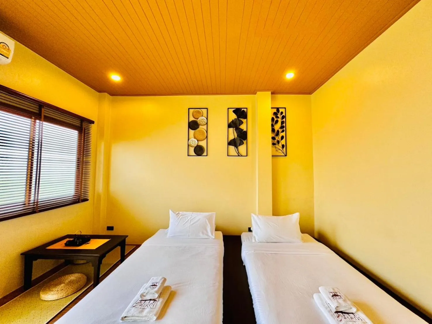 Bed in COZY SHIROI RESORT