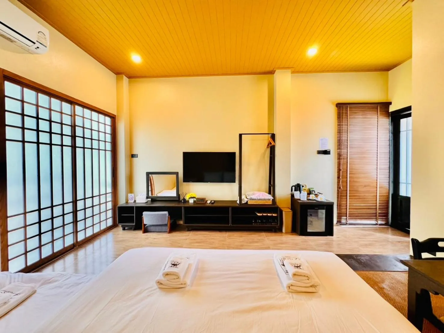 Bed in COZY SHIROI RESORT