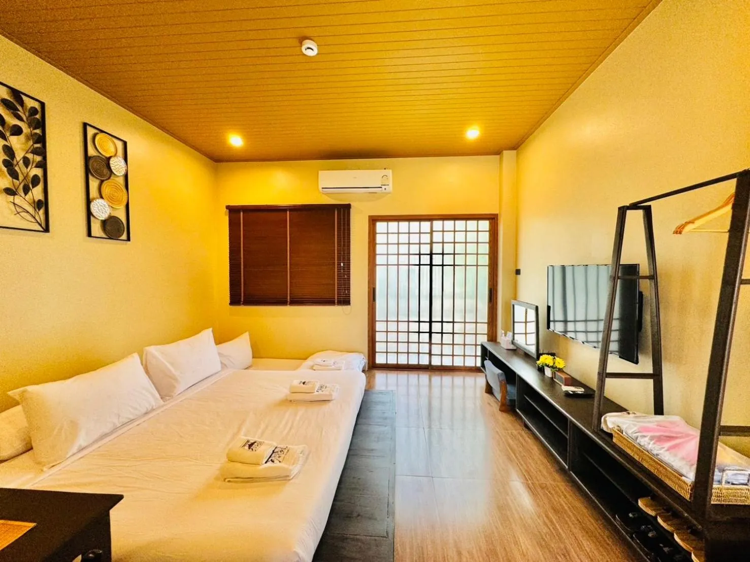 Living room, Bed in COZY SHIROI RESORT