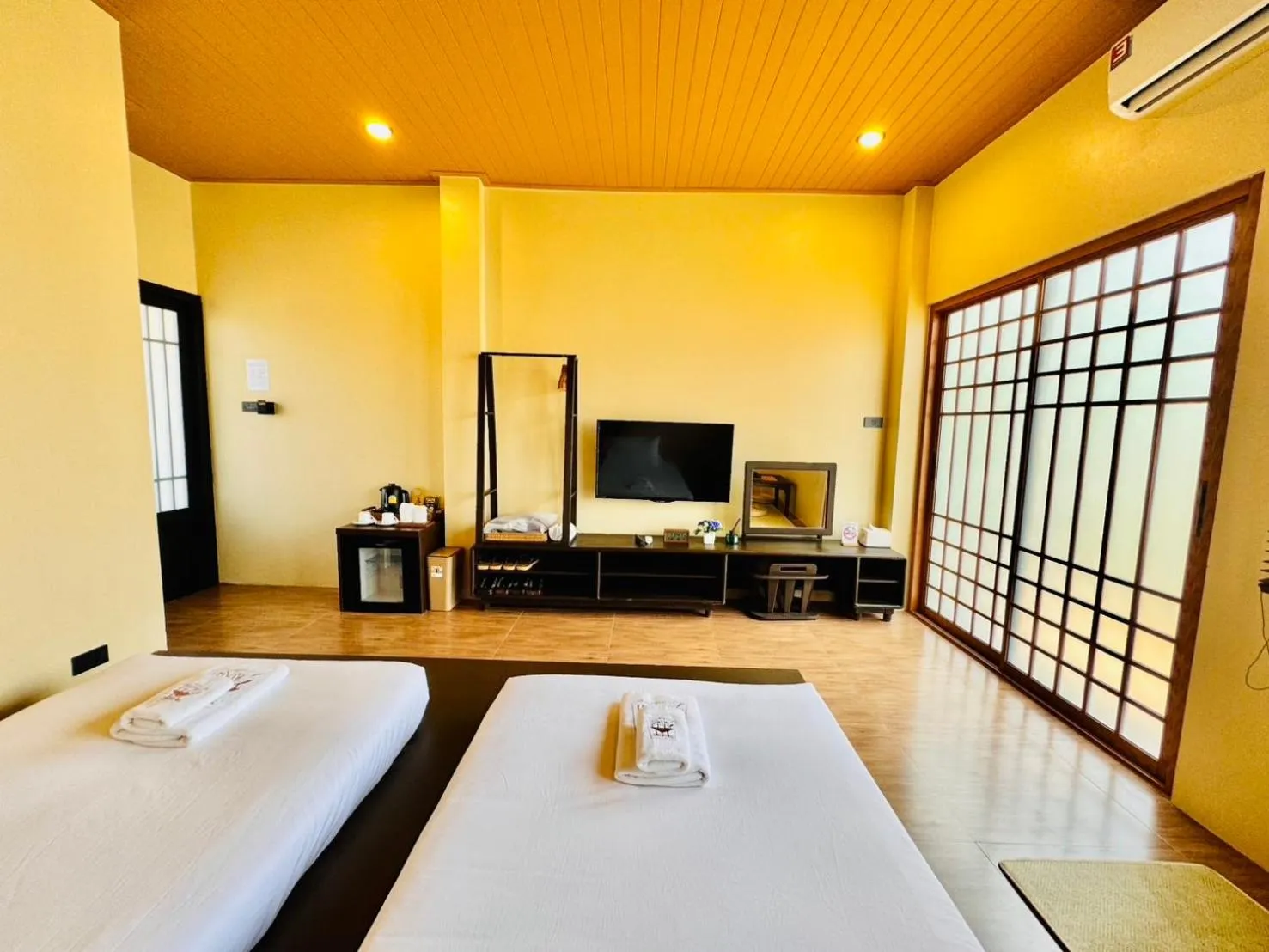 Bed in COZY SHIROI RESORT