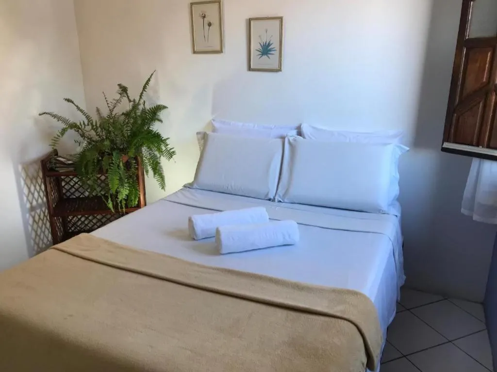 Bed in Pousada Velho Garimpo