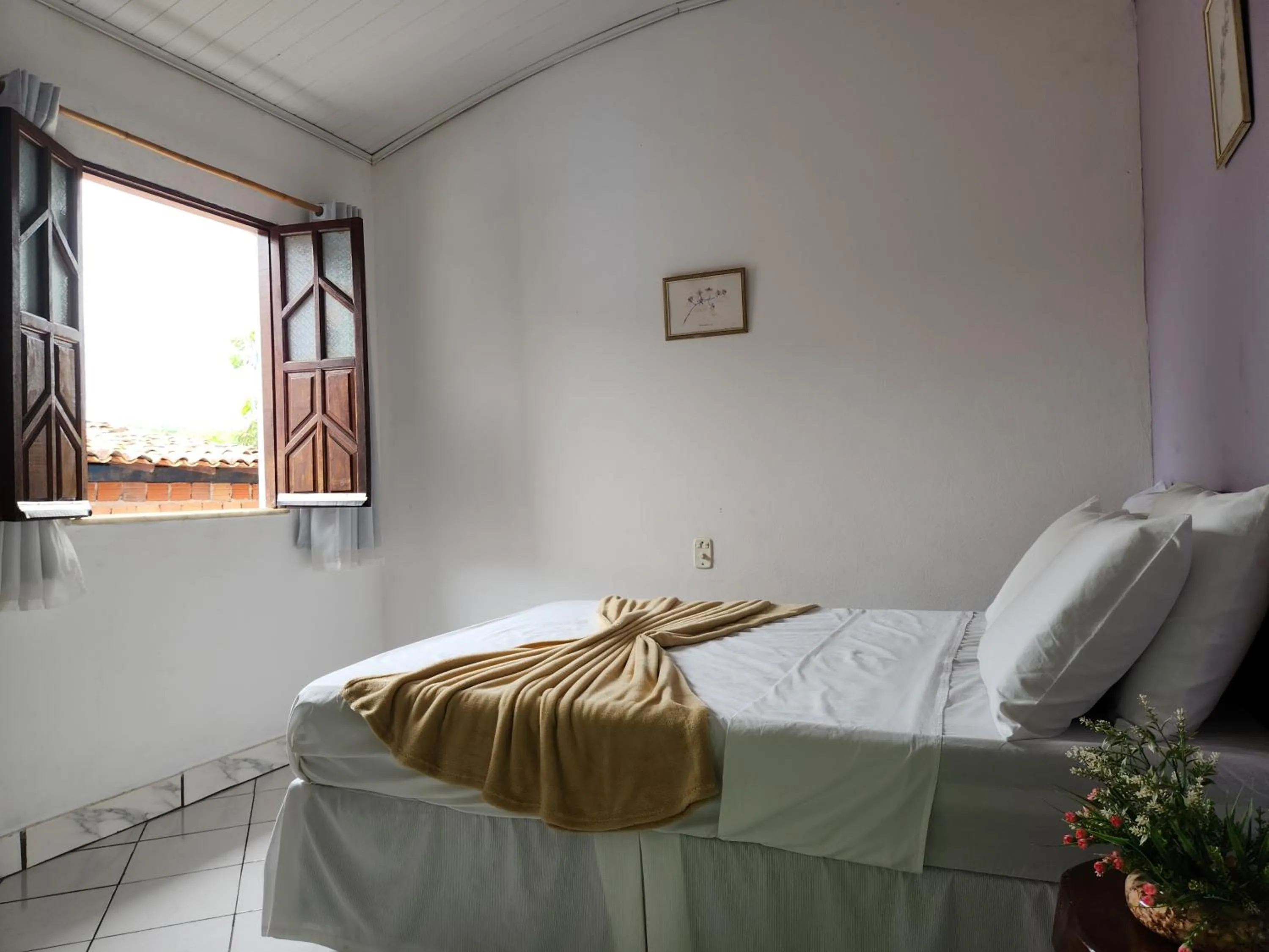 Bed in Pousada Velho Garimpo