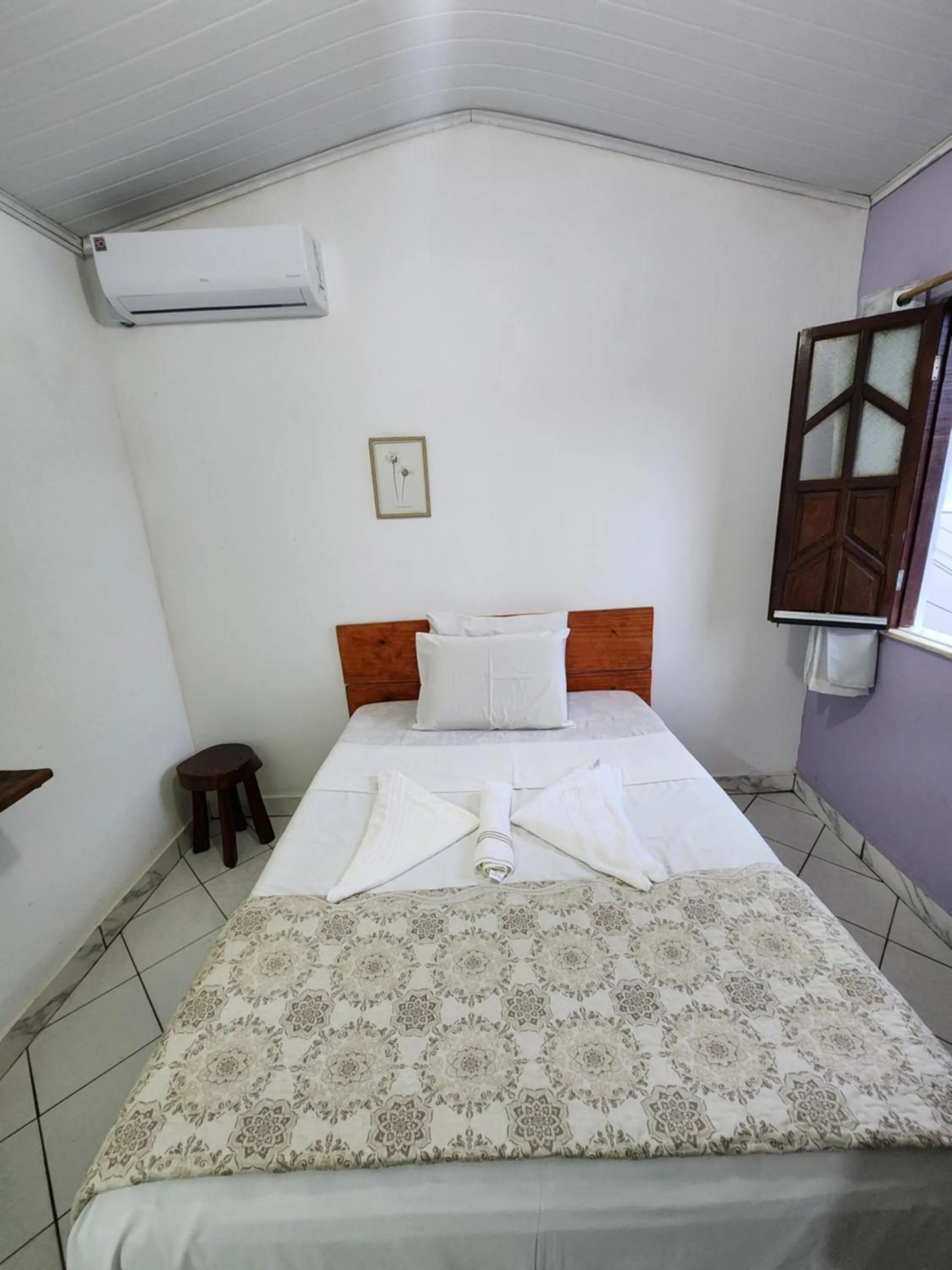 Bed in Pousada Velho Garimpo
