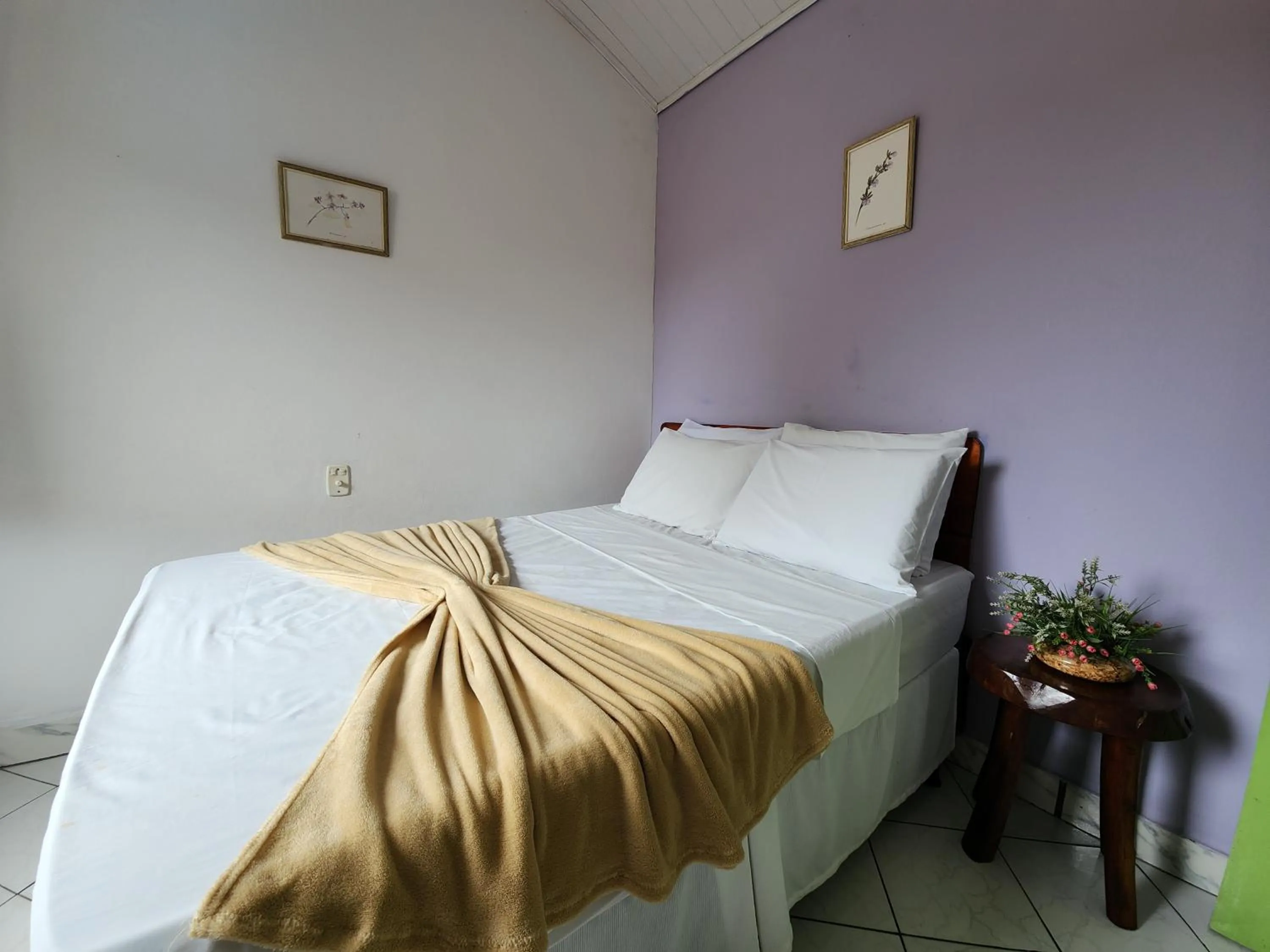 Bed in Pousada Velho Garimpo
