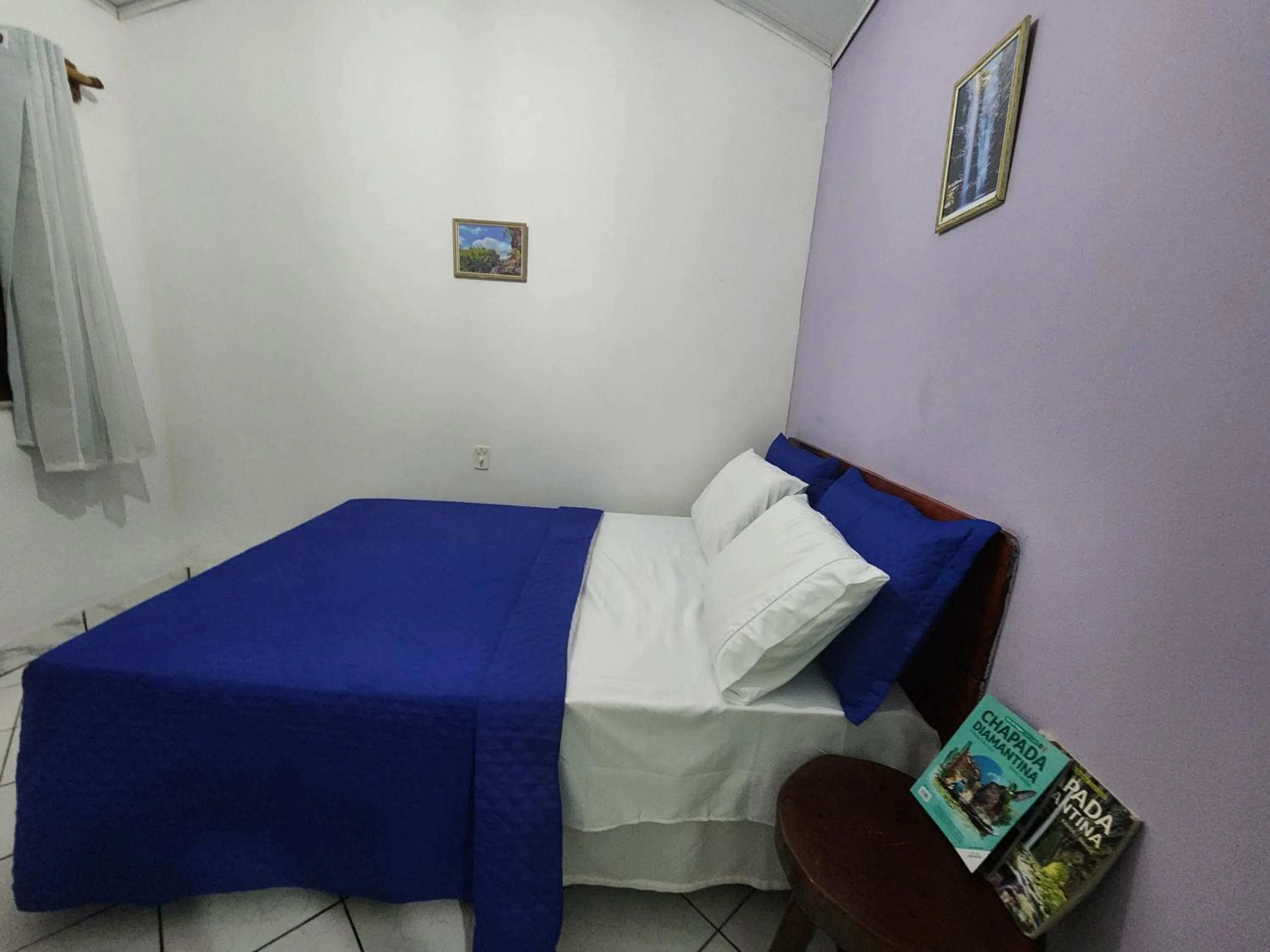 Bed in Pousada Velho Garimpo