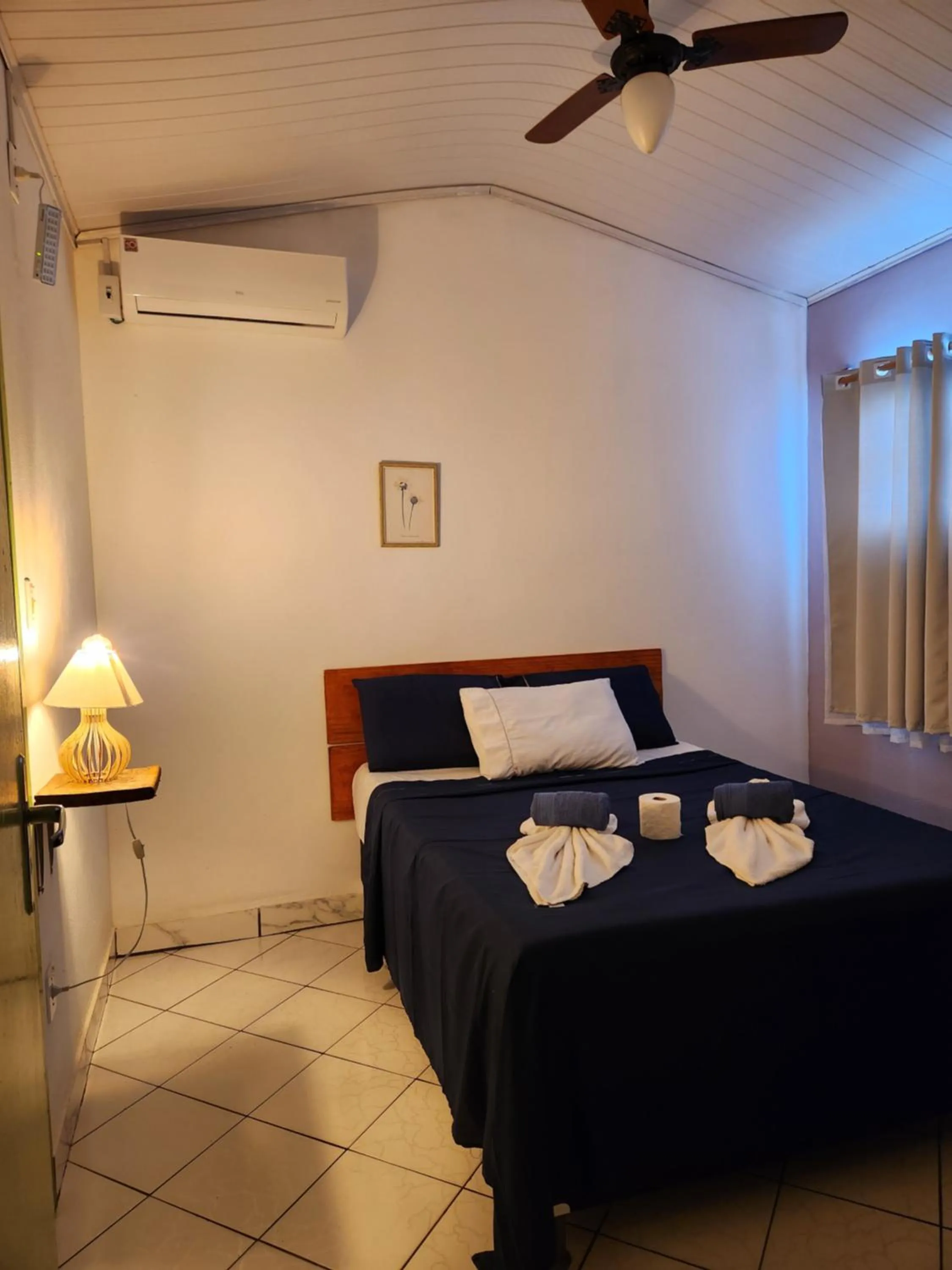 Bed in Pousada Velho Garimpo