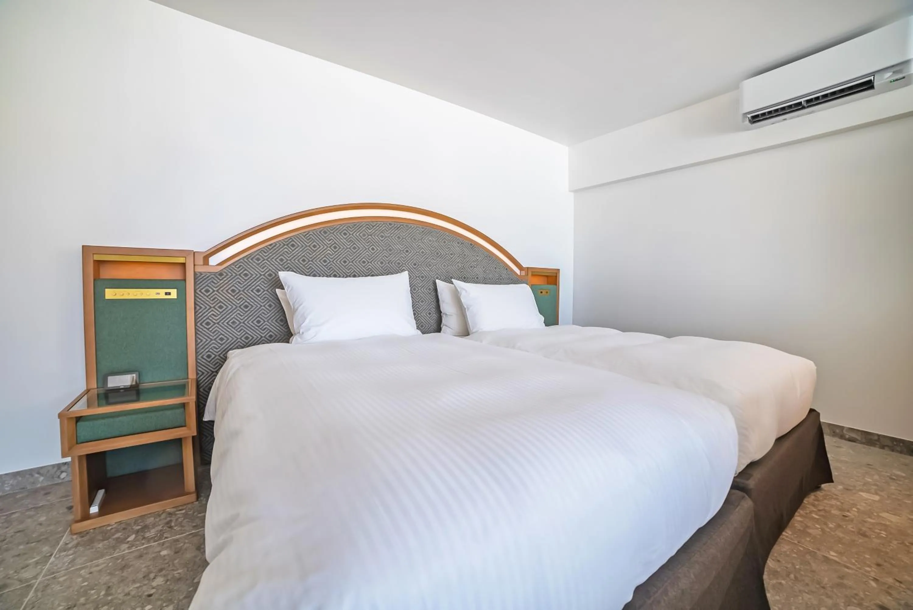 Bed in SANTORINI HOTEL&VILLAS MIYAKOJIMA