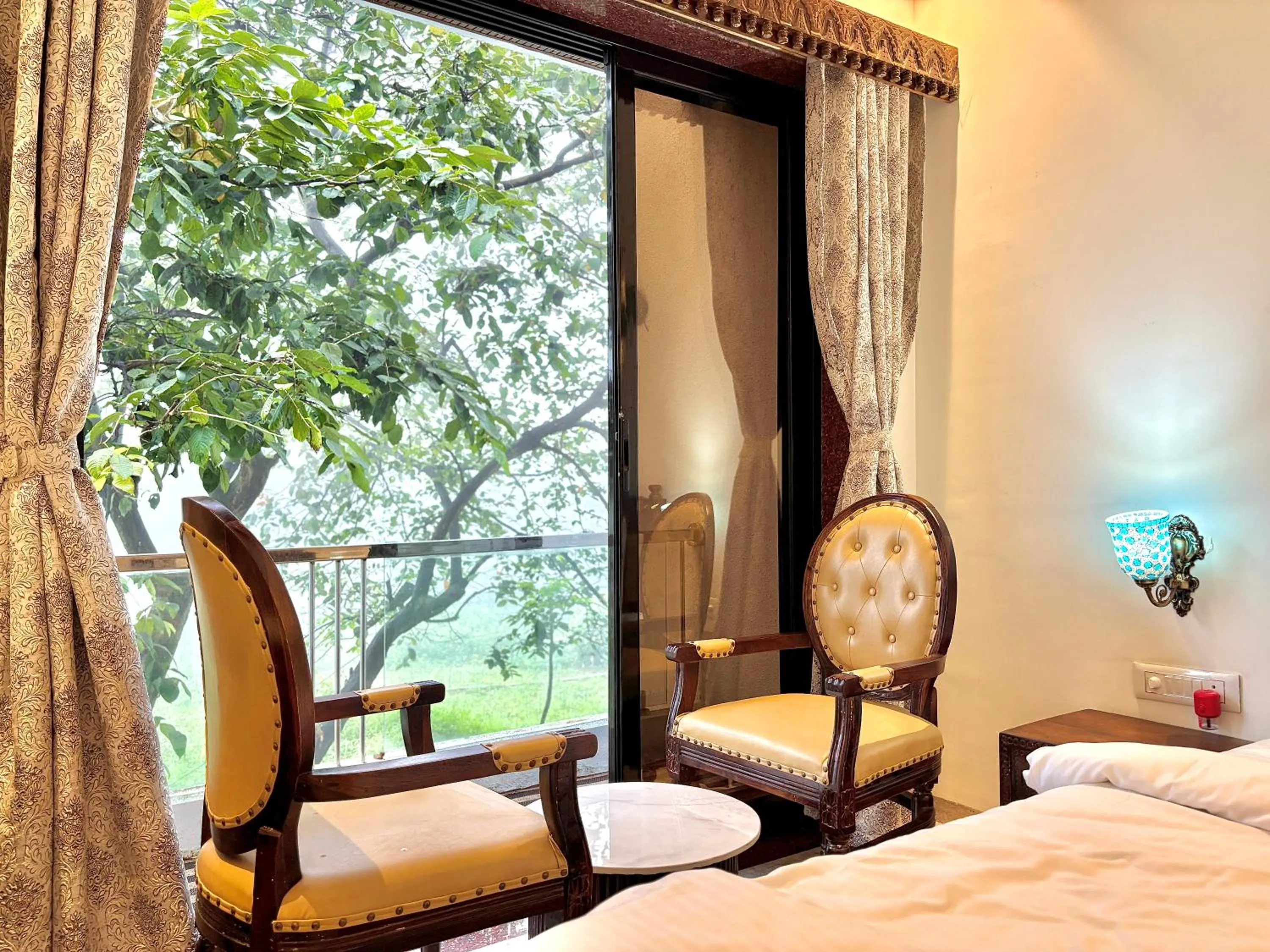 Seating area, Bed in Misty Blue Resort and Villas