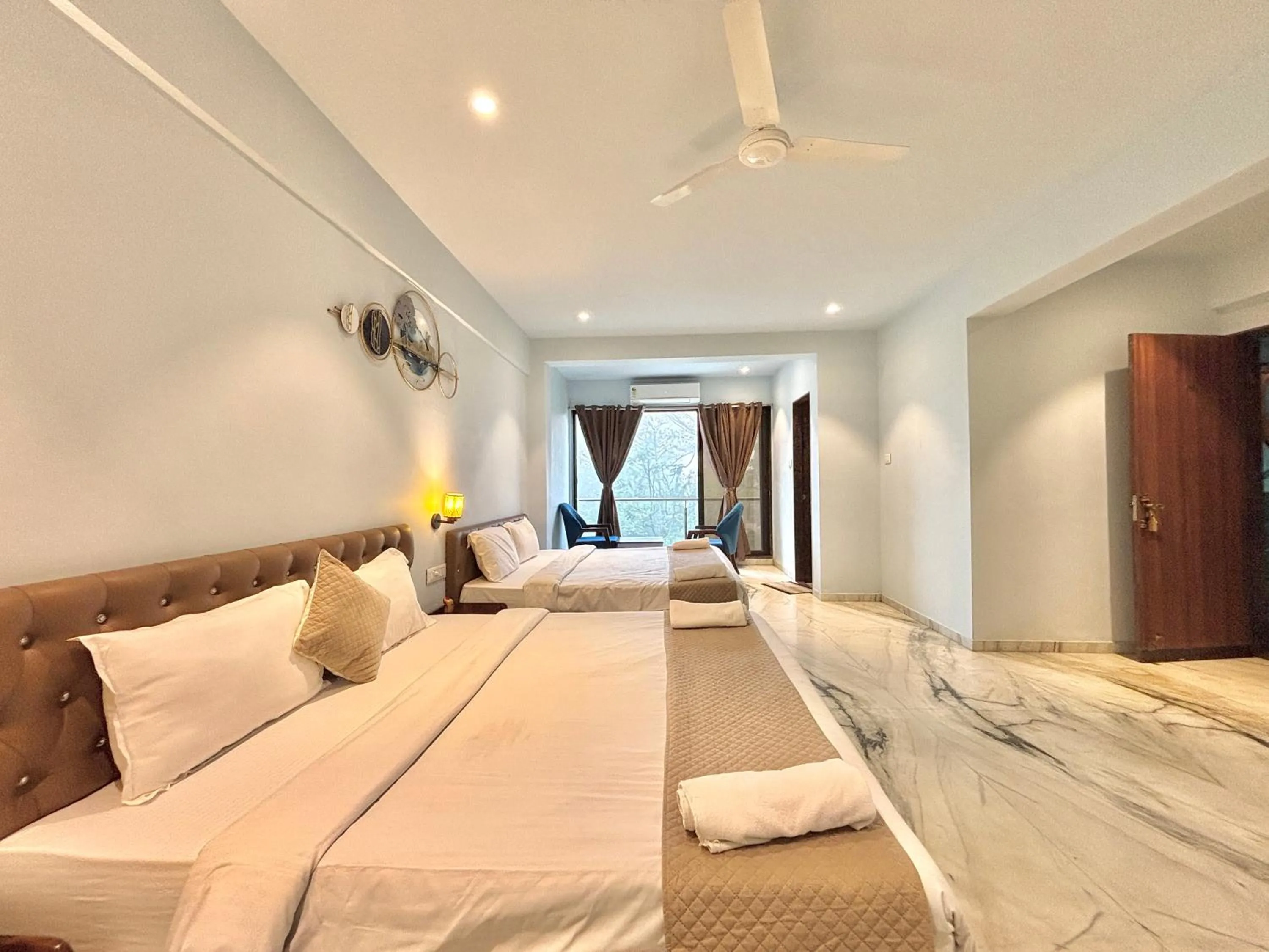 Seating area, Bed in Misty Blue Resort and Villas