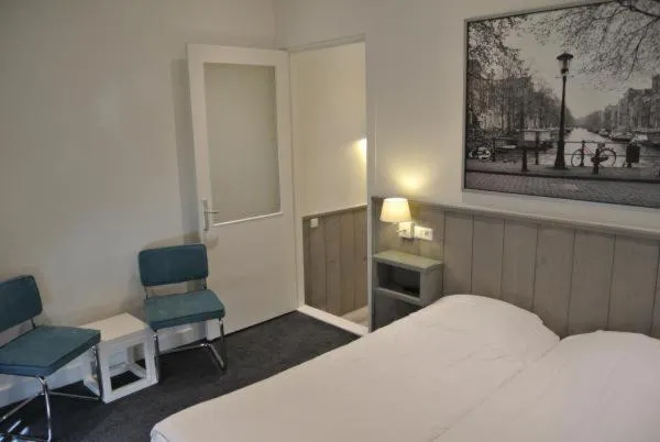 Communal lounge/ TV room, Bed in Hotel Doppenberg