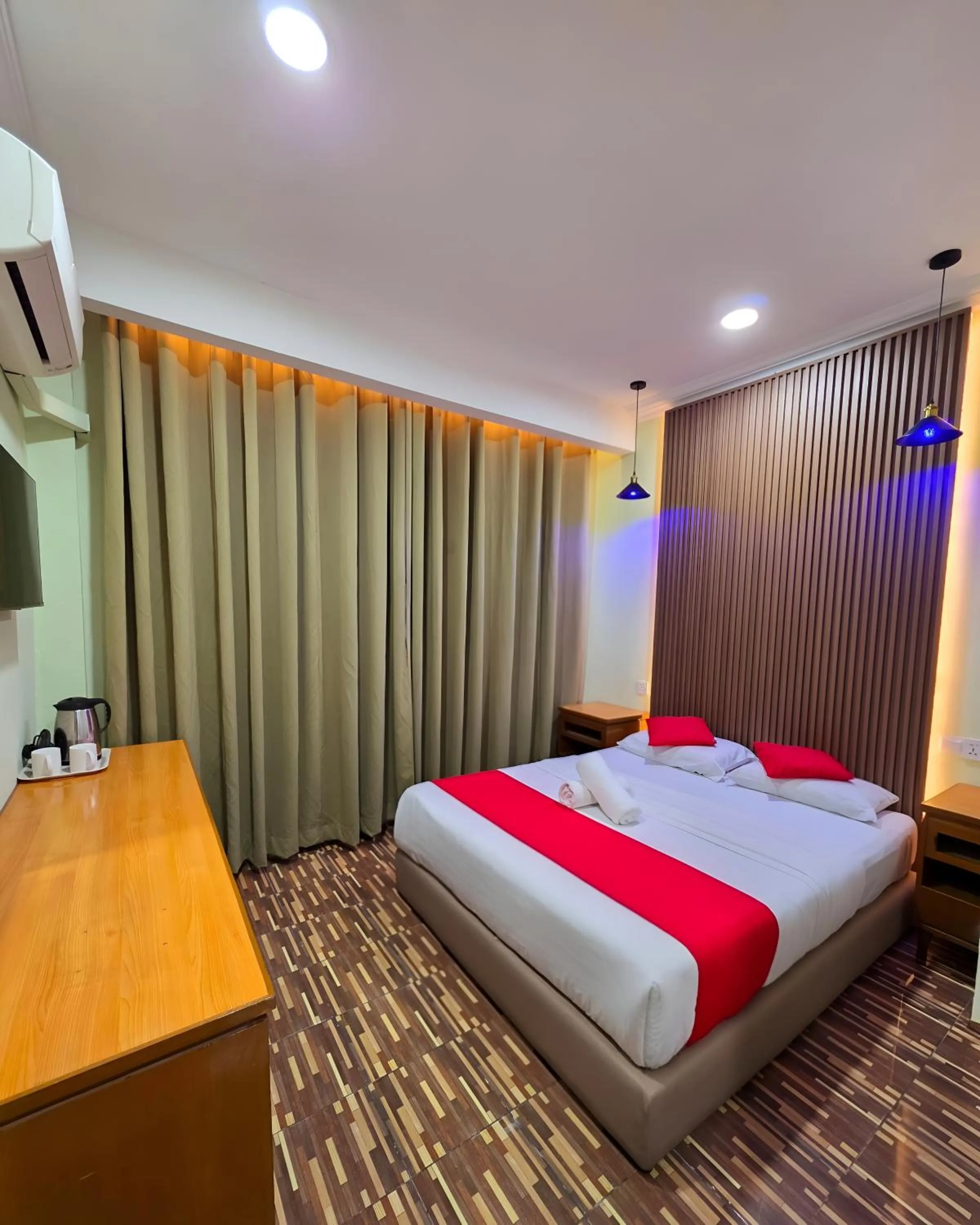 Bed in Grand Inn Hotel Semporna