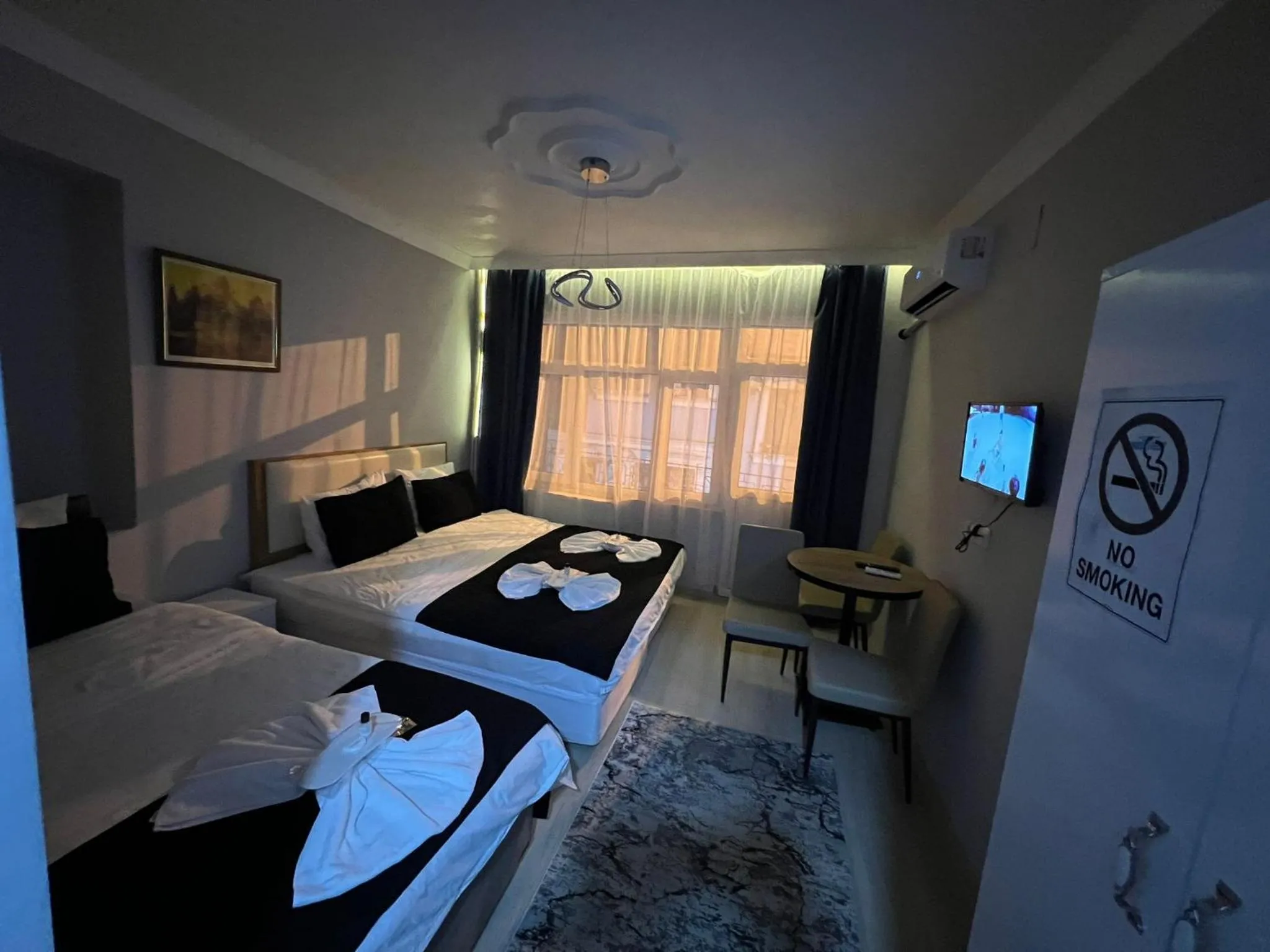 Communal lounge/ TV room, Bed in Taksim Milenyum Suites