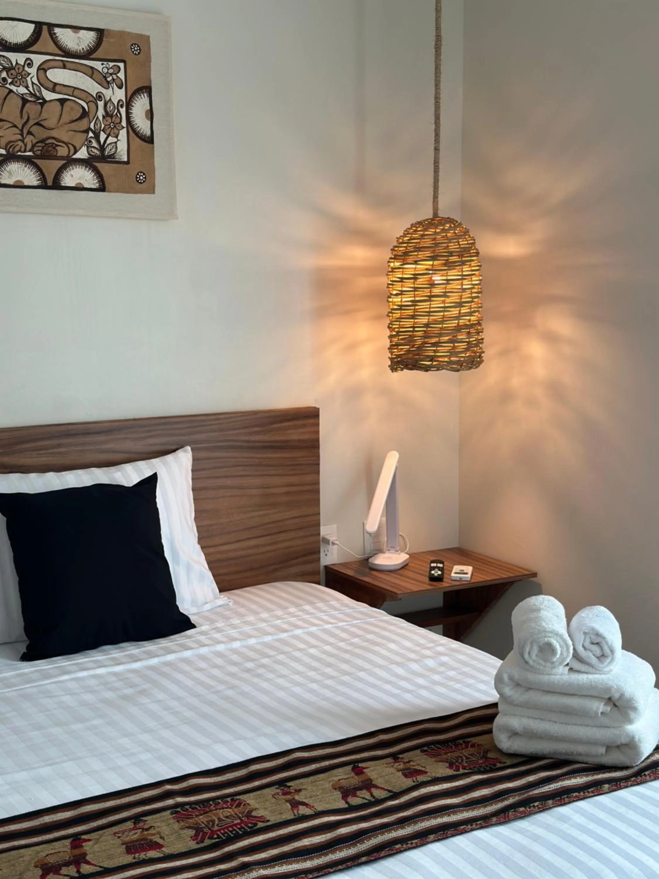 Bed in Oneiro Suites with Sea View
