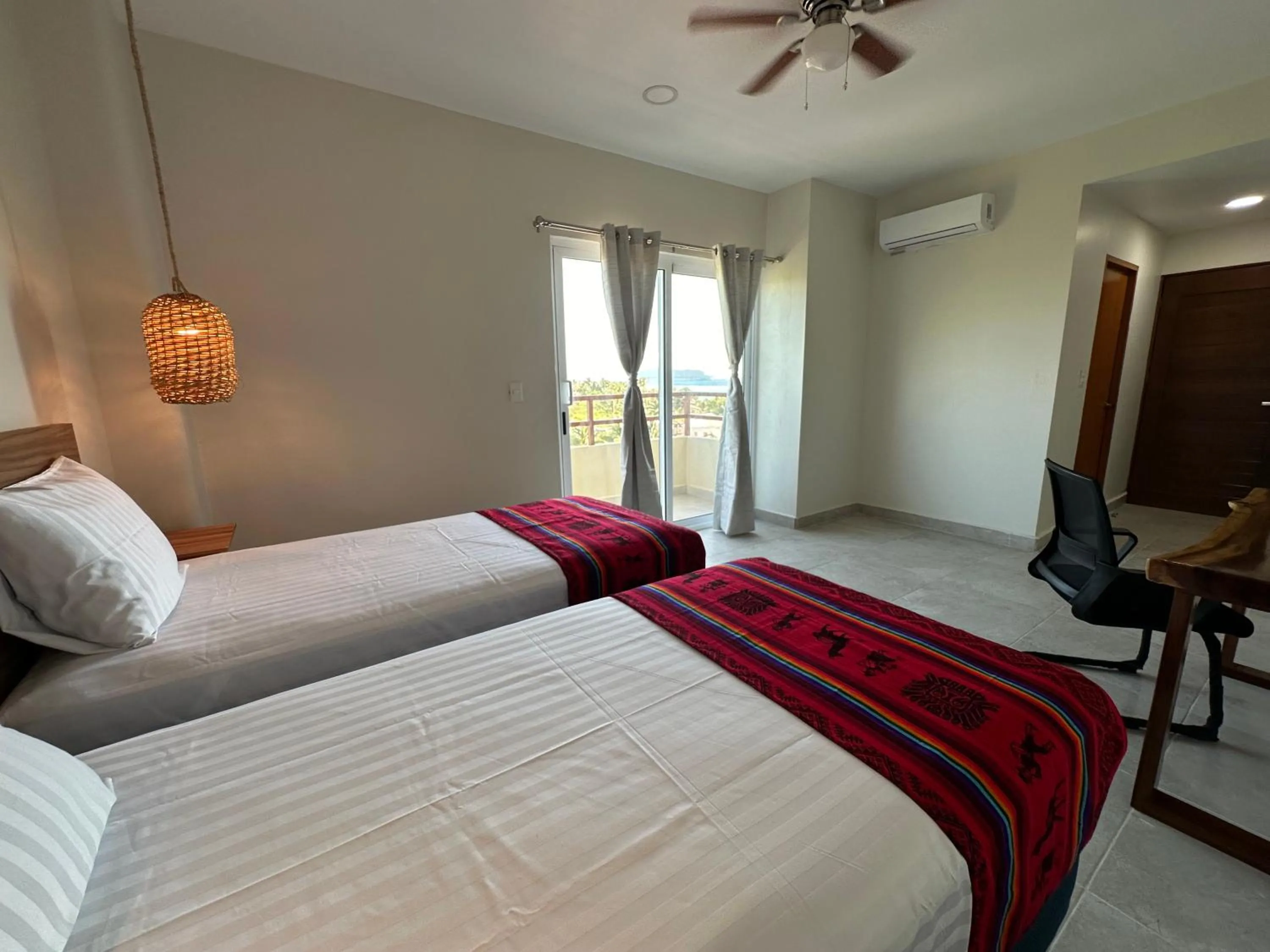 Bed in Oneiro Suites with Sea View