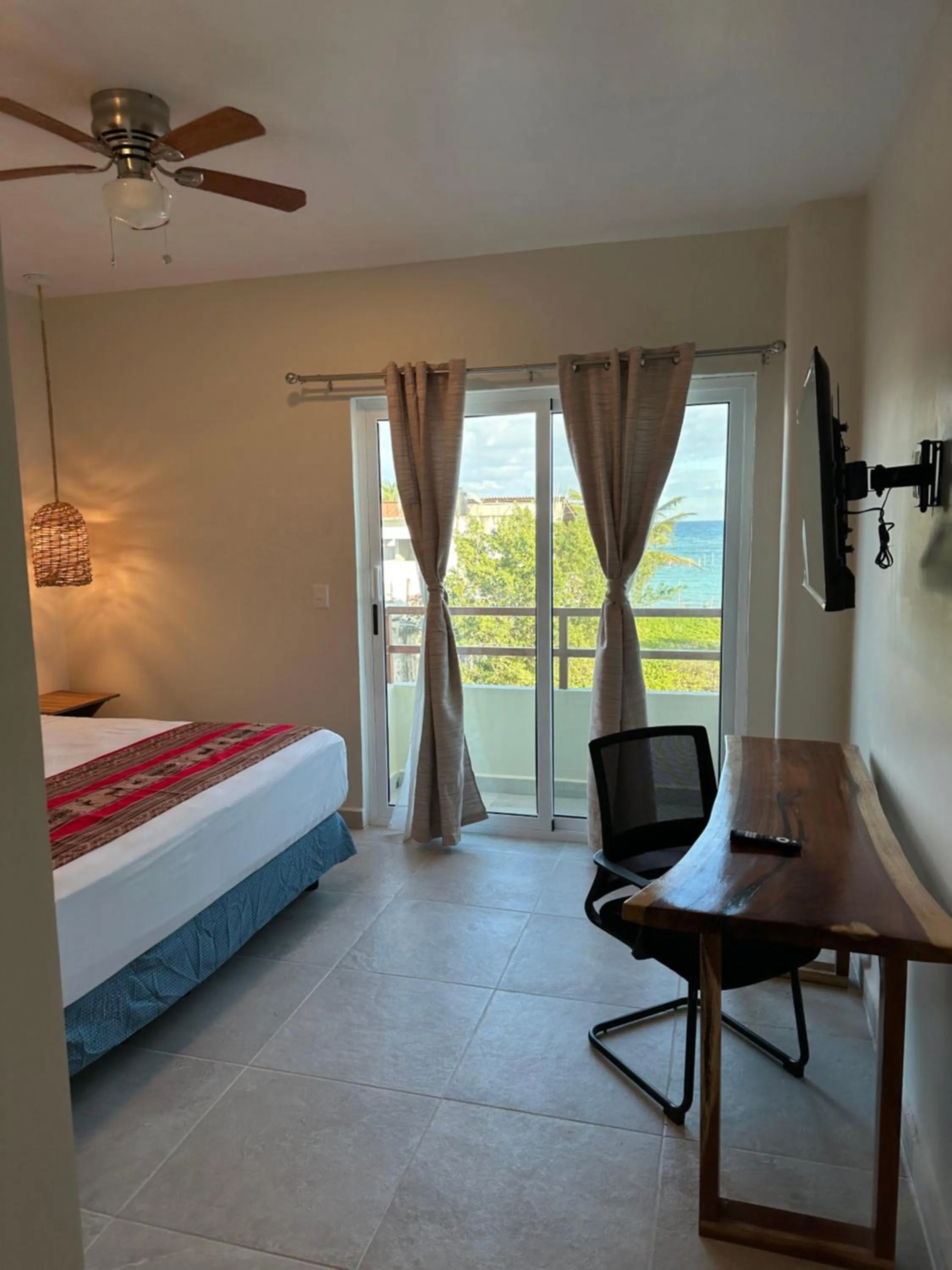 Bed in Oneiro Suites with Sea View