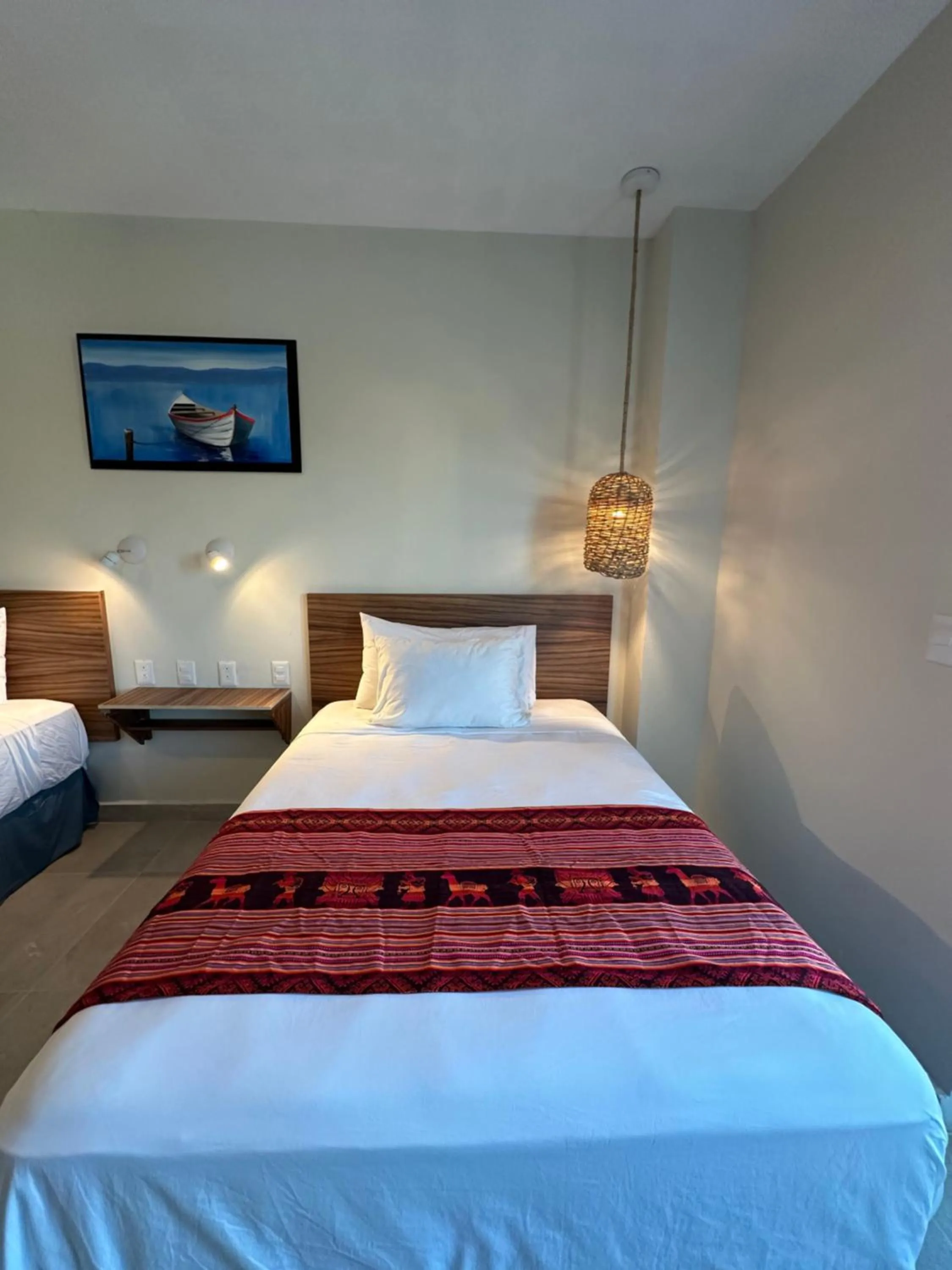 Bed in Oneiro Suites with Sea View