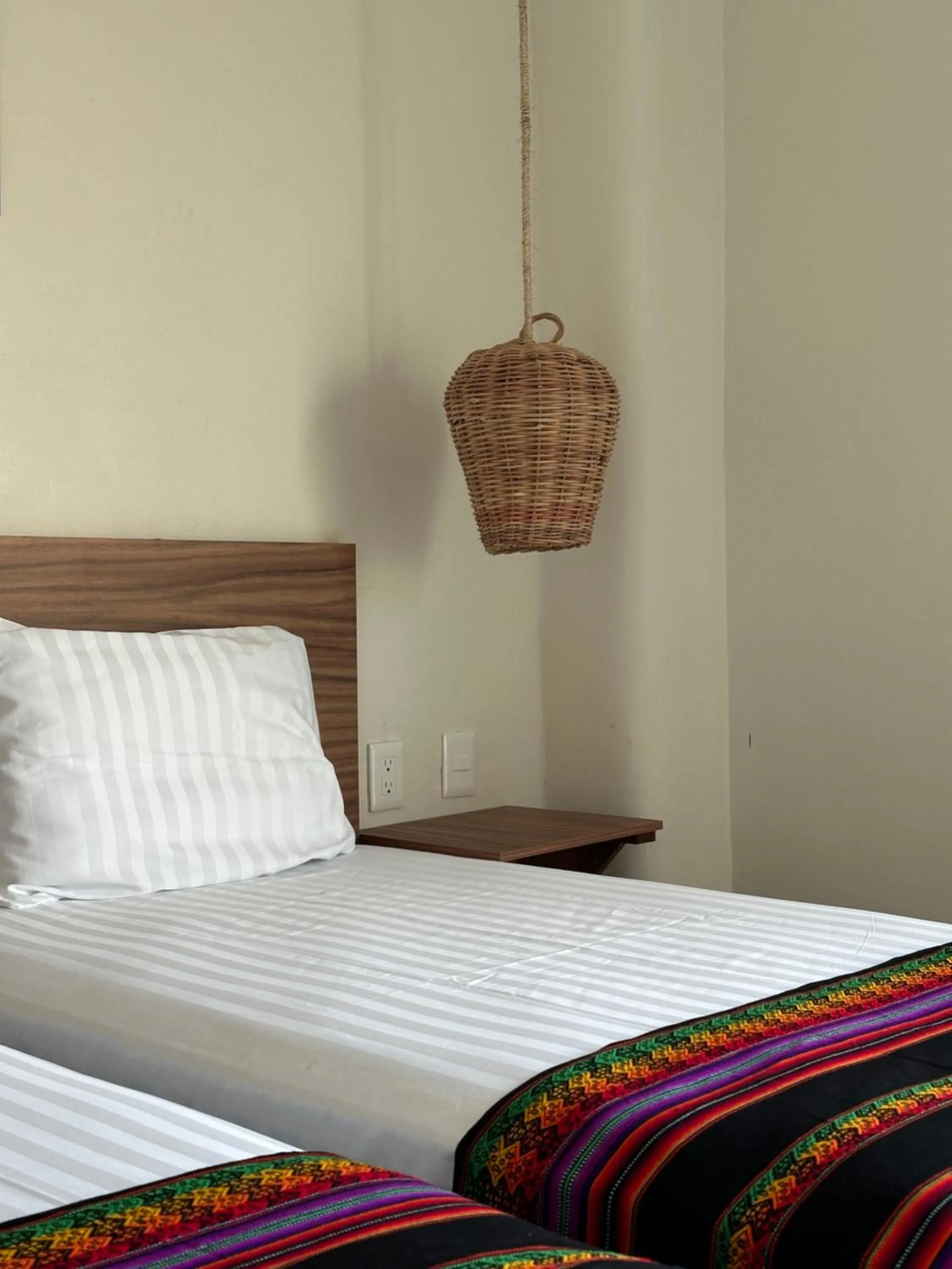 Bed in Oneiro Suites with Sea View