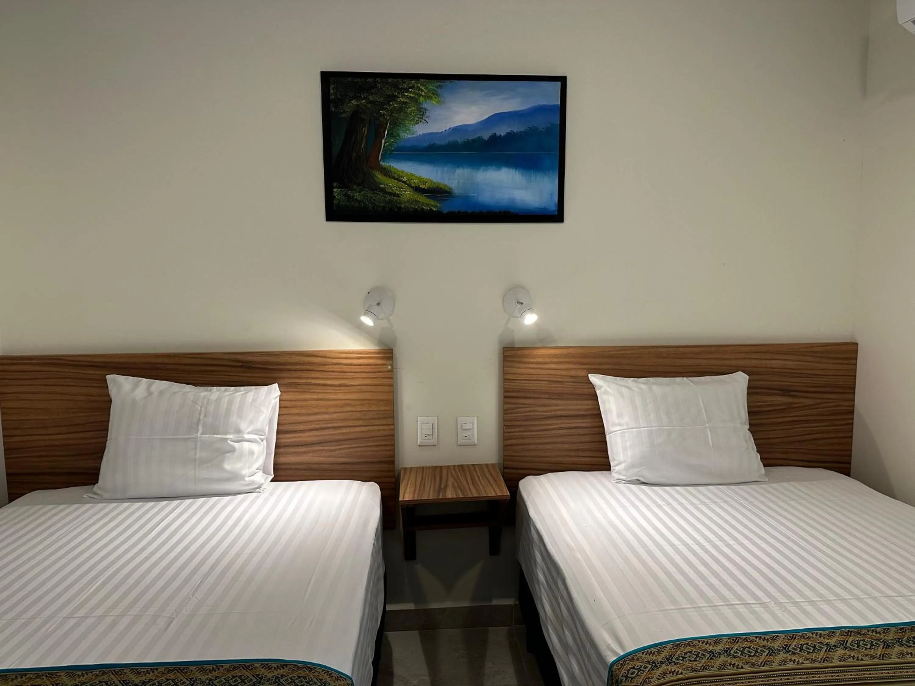 Bed in Oneiro Suites with Sea View